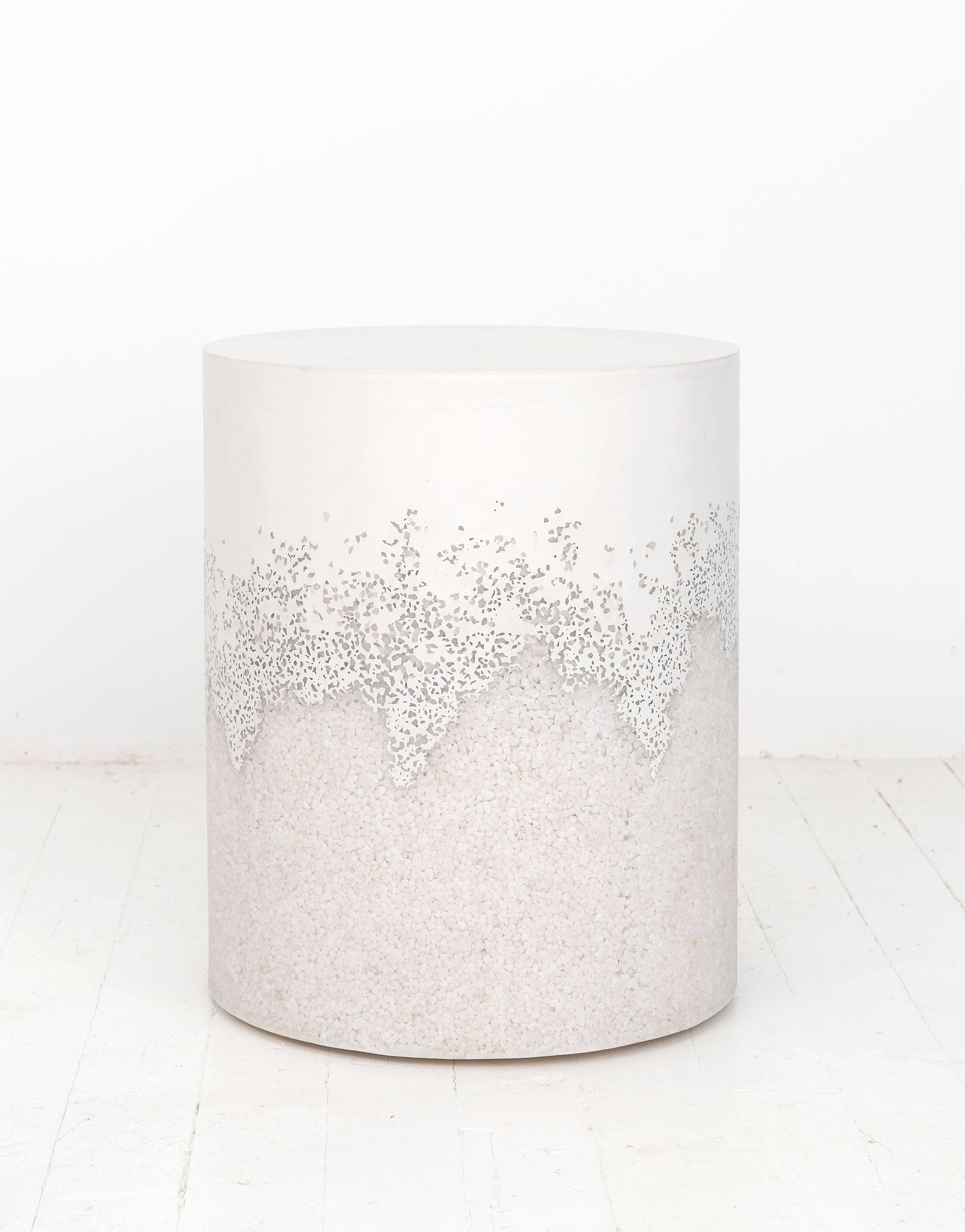 This made-to-order drum consists of a hand-dyed white cement top and a packed crystal quartz bottom. The cement is poured by hand over the quartz, creating an organic blend of the materials. The piece has a hollow cavity and weighs approximately