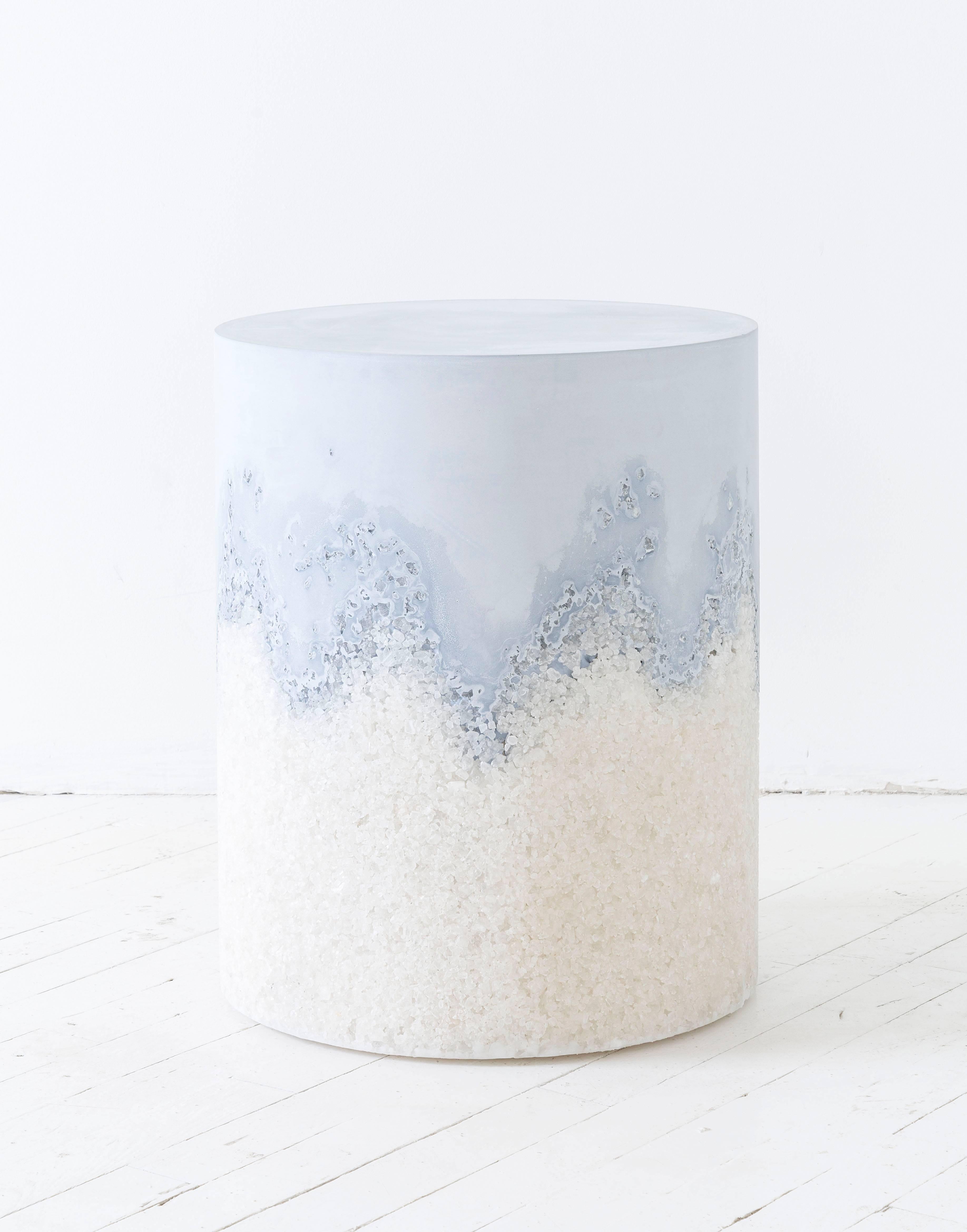 This made-to-order drum consists of a hand-dyed ice blue cement top and a packed white rock salt bottom. The cement is poured by hand over the salt, creating an organic barrier between the two materials. The piece has a hollow cavity and weighs