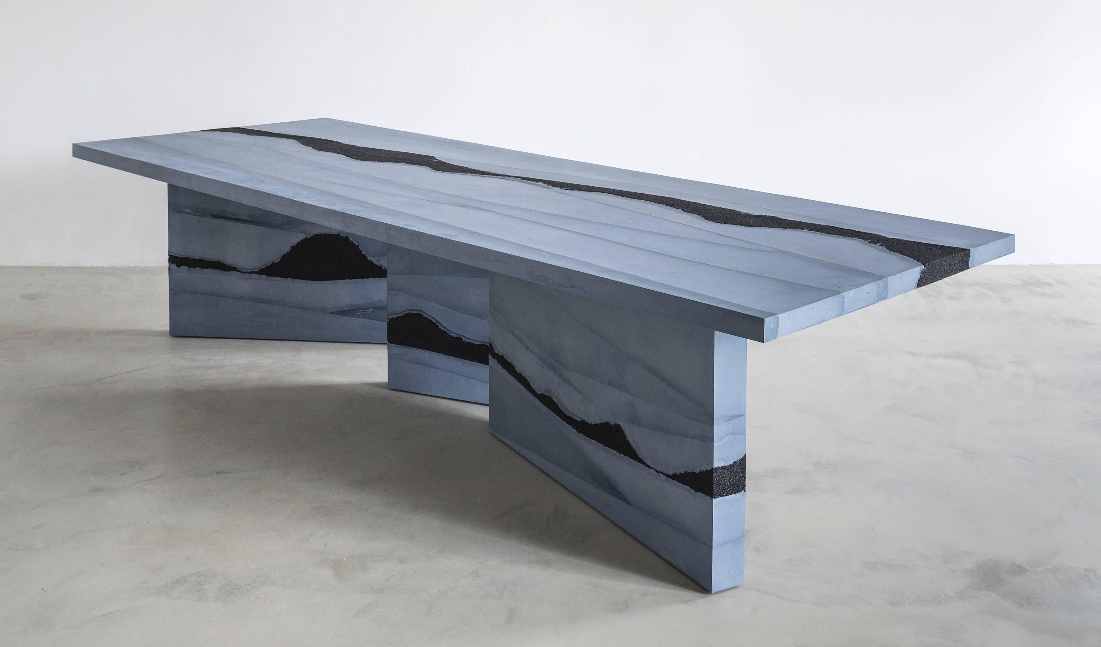 This made-to-order dining table consists of a hand-dyed slate cement and black silica. The silica is embedded directly within the cement in an organic nature. 12 - 14 Weeks Lead Time. Custom options available, please inquire with the studio.