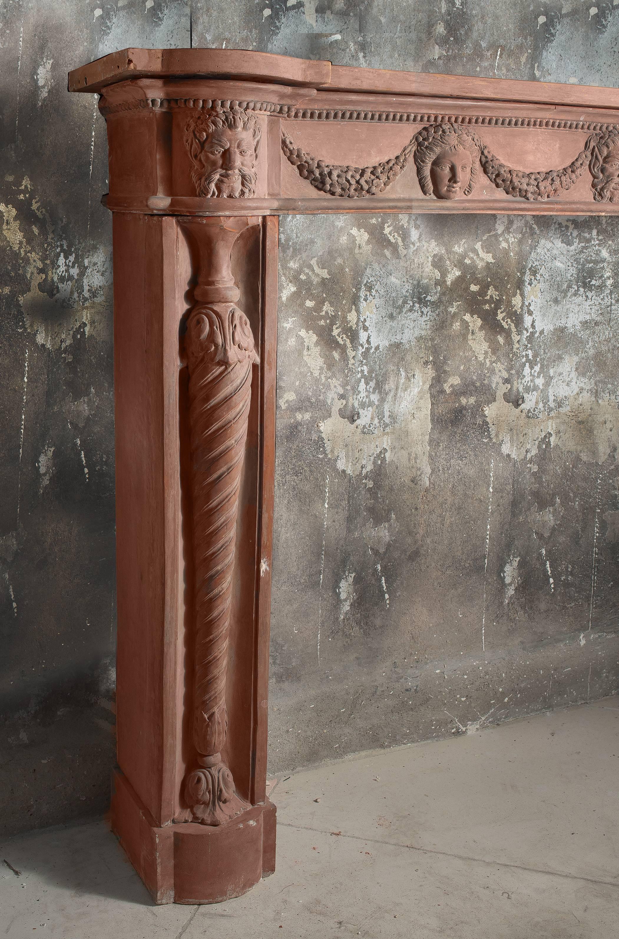 Beautiful fireplace in terracotta in a Louis XVI style, from the Directoire period.
  