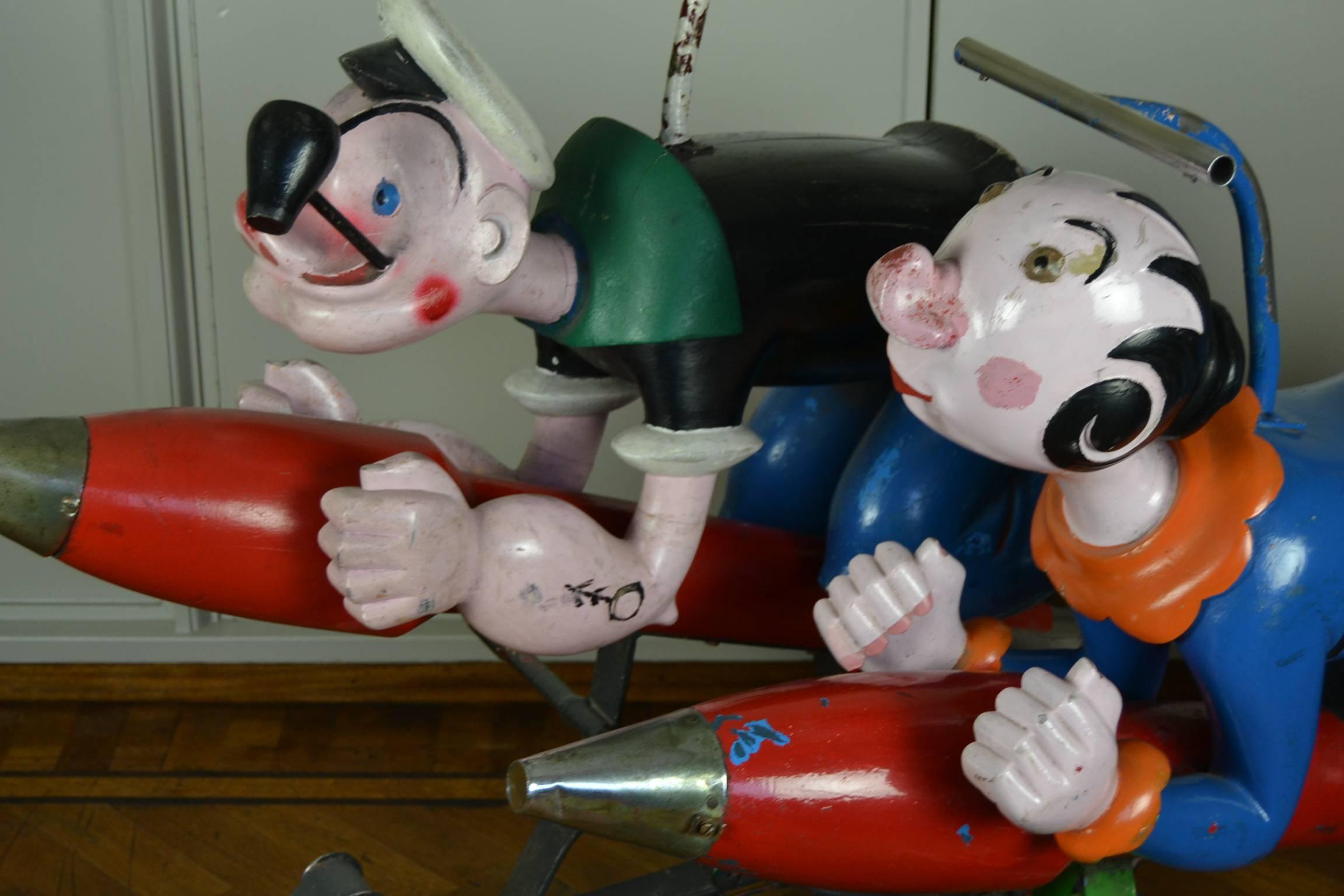 Popeye and Olive Oyl Carousel Sculptures by Bernard Kindt.  
This awesome couple of comic characters  or animated cartoon characters are known worlwide and nostalgic for many among us. I'm Popeye the sailor man, tuut tuut.

These Wooden Carnival Art