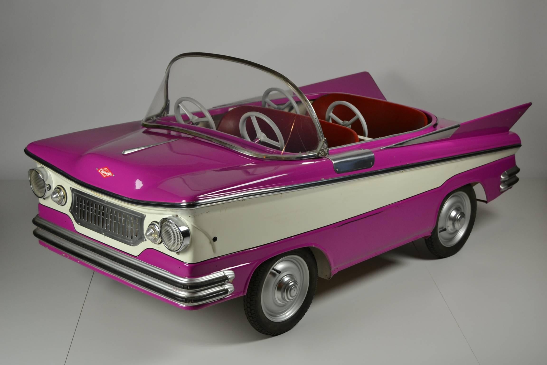Fairground Memorabilia ......  
A handmade Nostalgic metal Child's carousel Car by L'Autopède Belgium.
Oldtimer Buick 4-seat convertible American Car.
This Child's car has been produced from 1959 - 1970.  

Definitely the children's favourit
