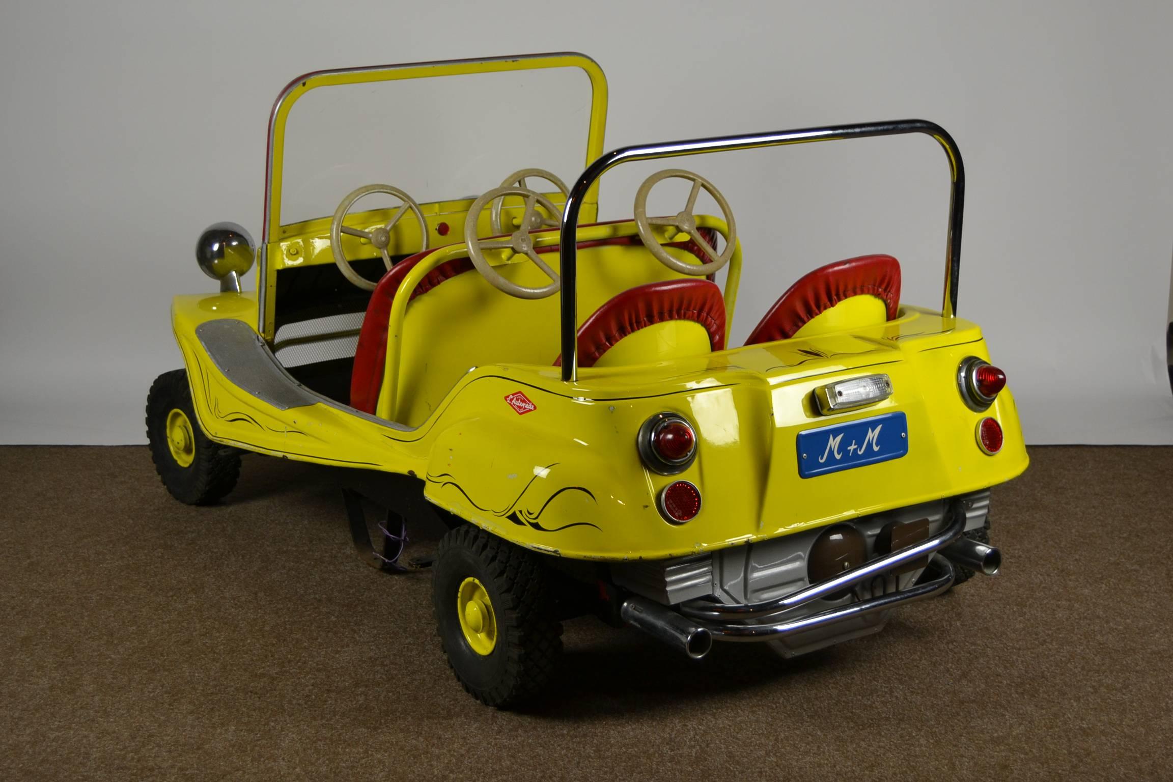Awesome metal Carnival Ride Car .
A Dune Buggy made by the Famous L'Autopède Company - Belgium in the seventies. 
Solid handmade 4-seat metal child's car type Surf Vehicle .
Real Belgian heritage to cherish.
  