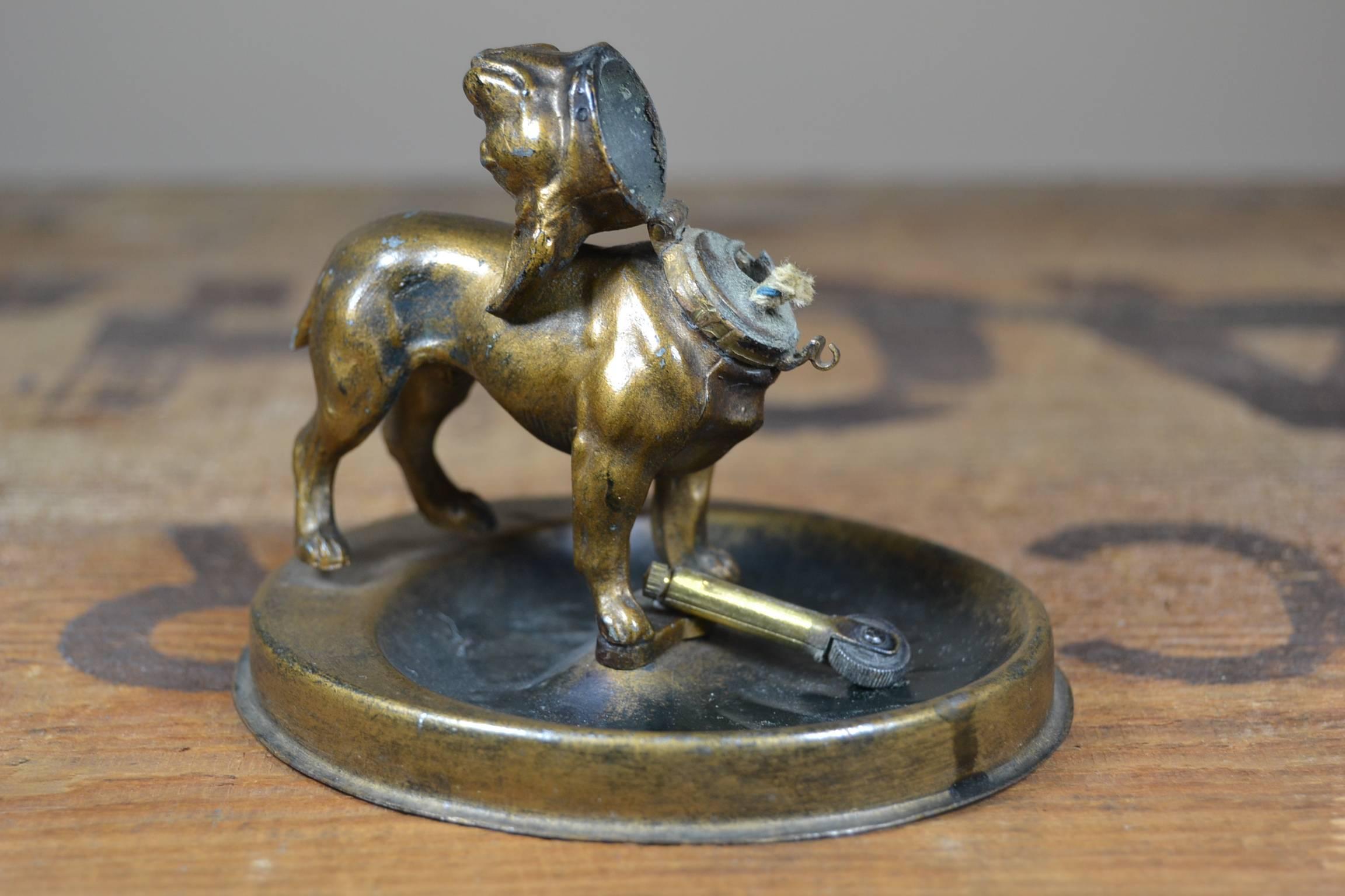 Antique cold bronze painted, metal dog figural, cigarette lighter on original base. Made by Demley, circa 1910.
 