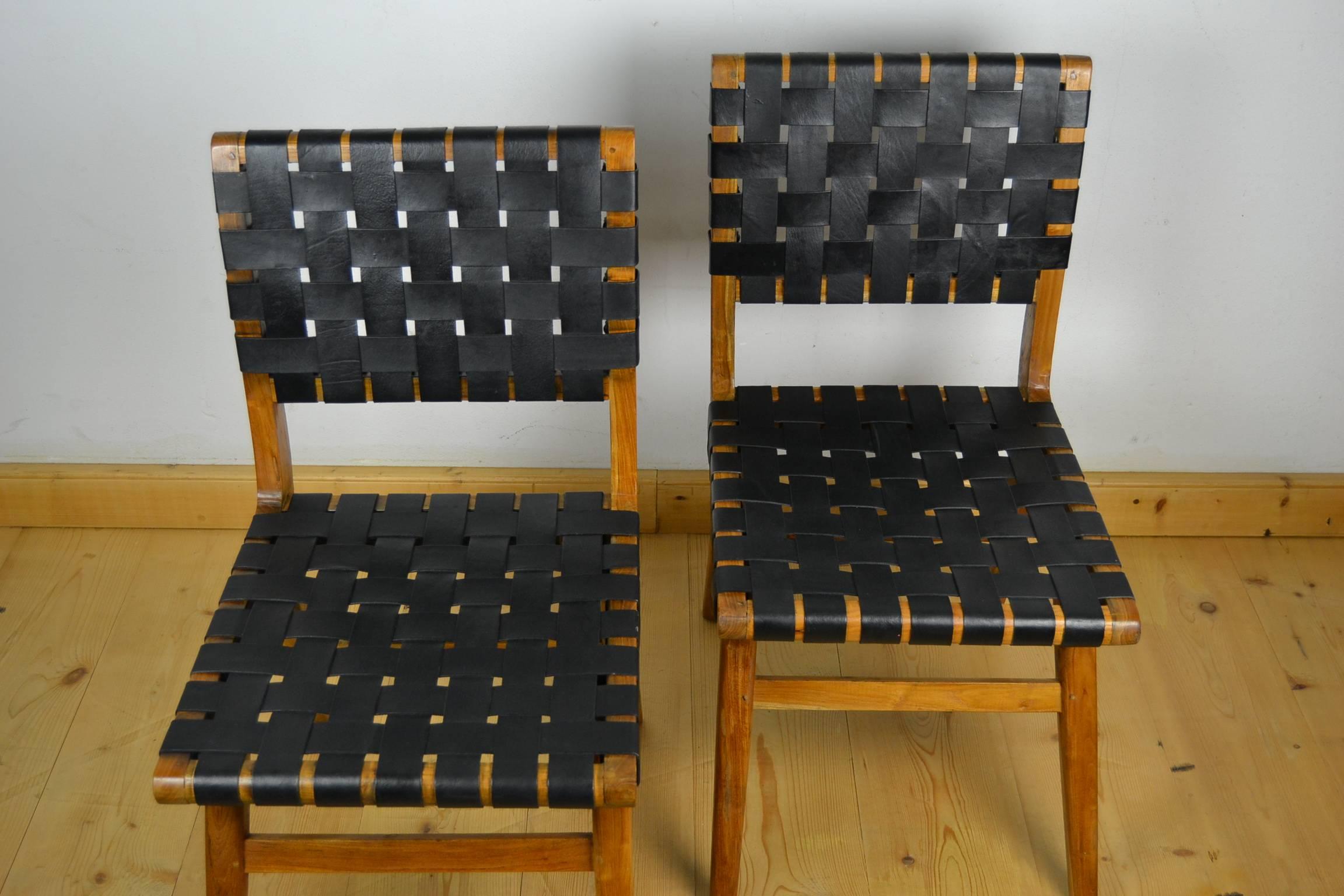 Set of two vintage dining chairs - side chairs in the style of Jens Risom & Mel Smilow. Black leather webbing chairs circa 1950 with walnut frame.
Mid-Century Modern - Scandinavian style. 
Both in good used vintage condition. 
Price is for two