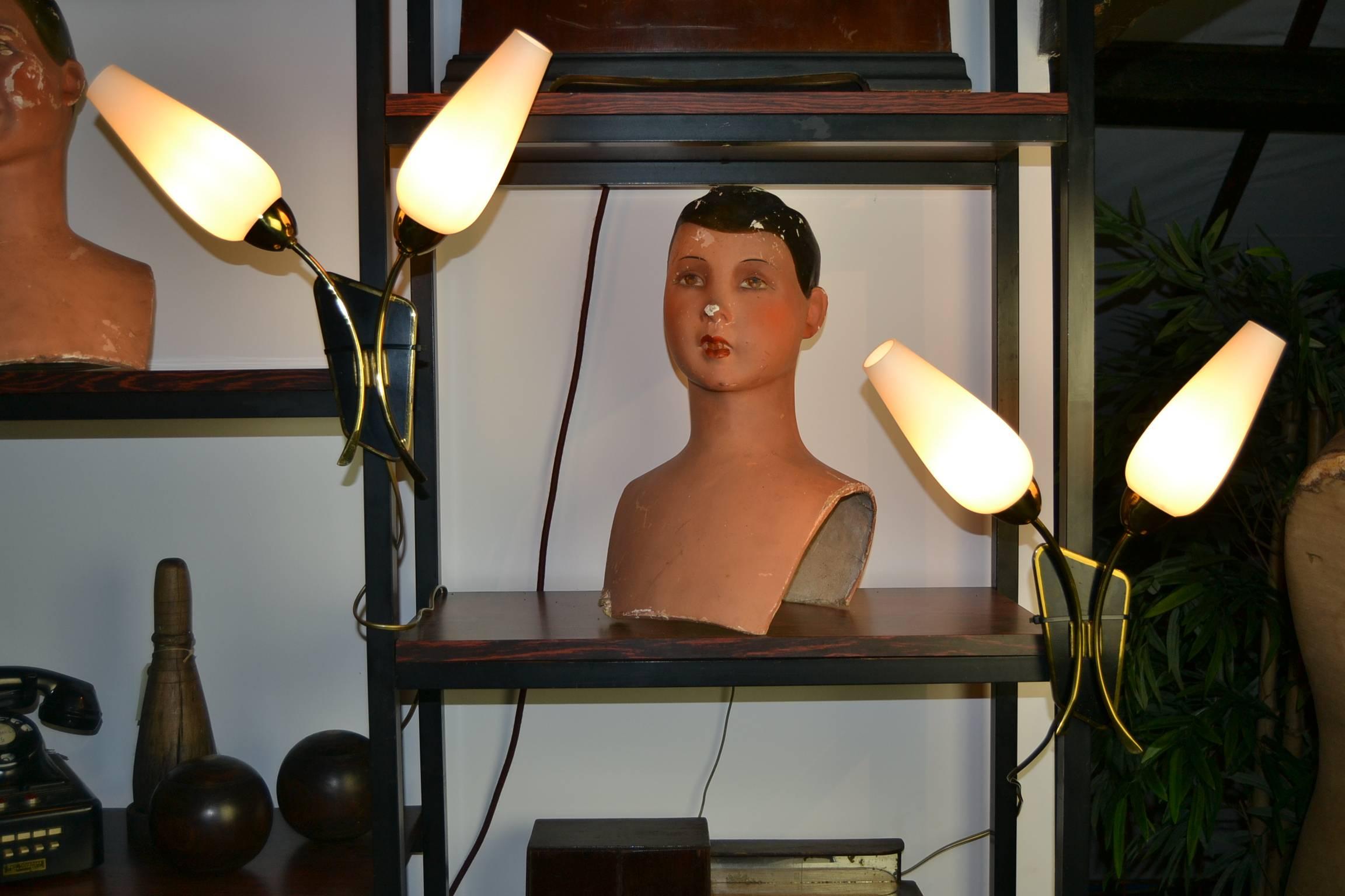 Stylish pair of vintage French sconces, wall lights, circa 1950.
Frosted glass shades, brass and black laquered backplate.
Mid-Century Modern or Stilnovo style.
Price is for the pair.