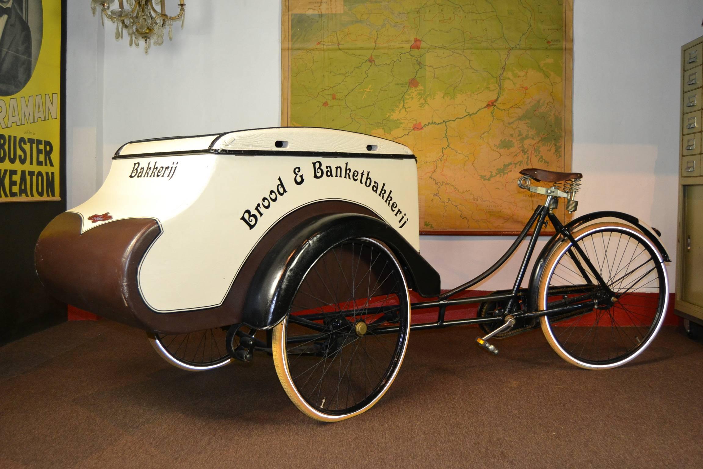 Awesome old delivery bike - delivery tricycle - cargobike.
This one was used by a former bakery shop in Antwerp and has a very beautiful design and shape. Special form of mudguards what makes this bike different.

The cargo bike has an old