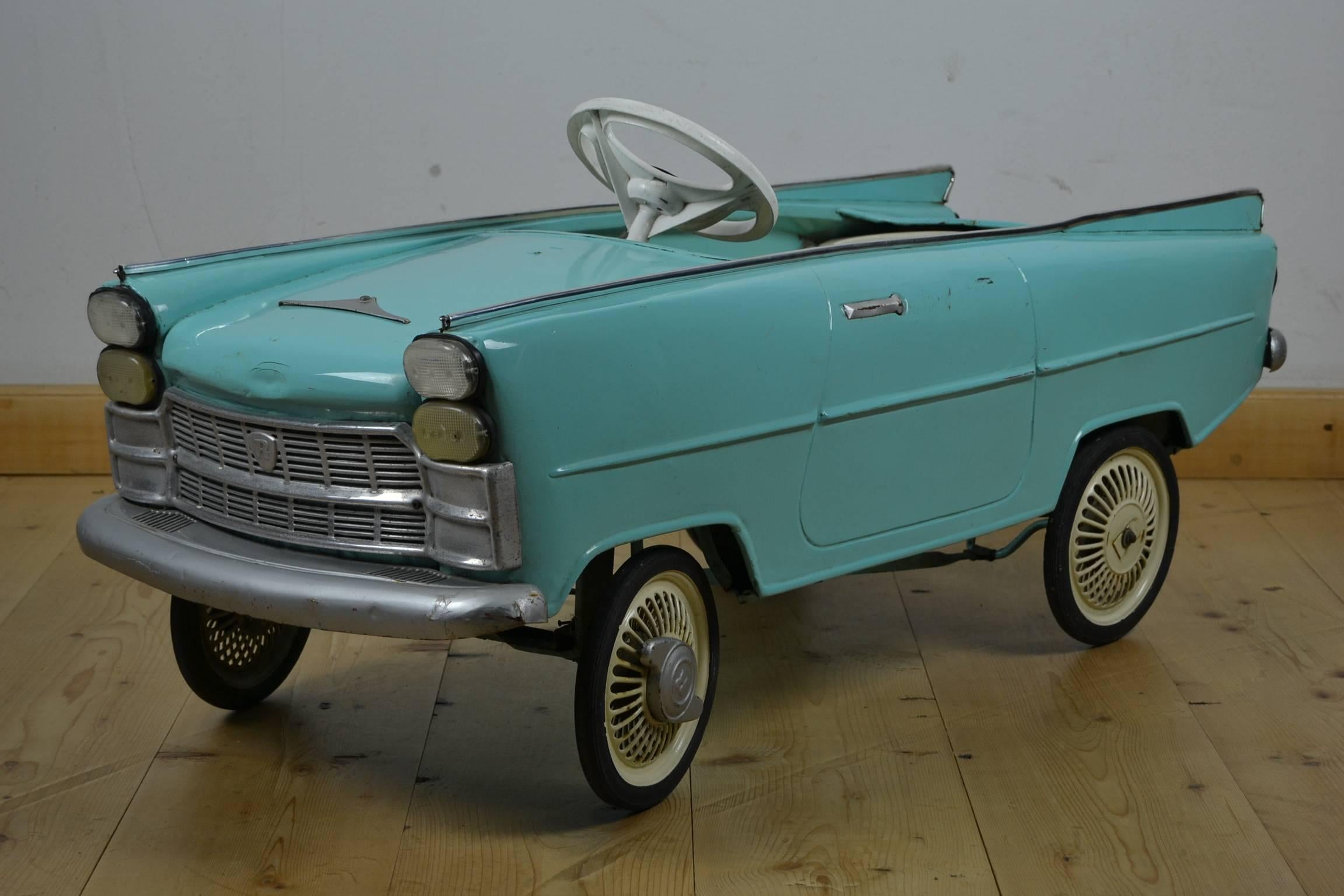 Metal pedal car made by Rosca Italy in the 1960s.
Based on Italian road car Fiat 2100. 

 