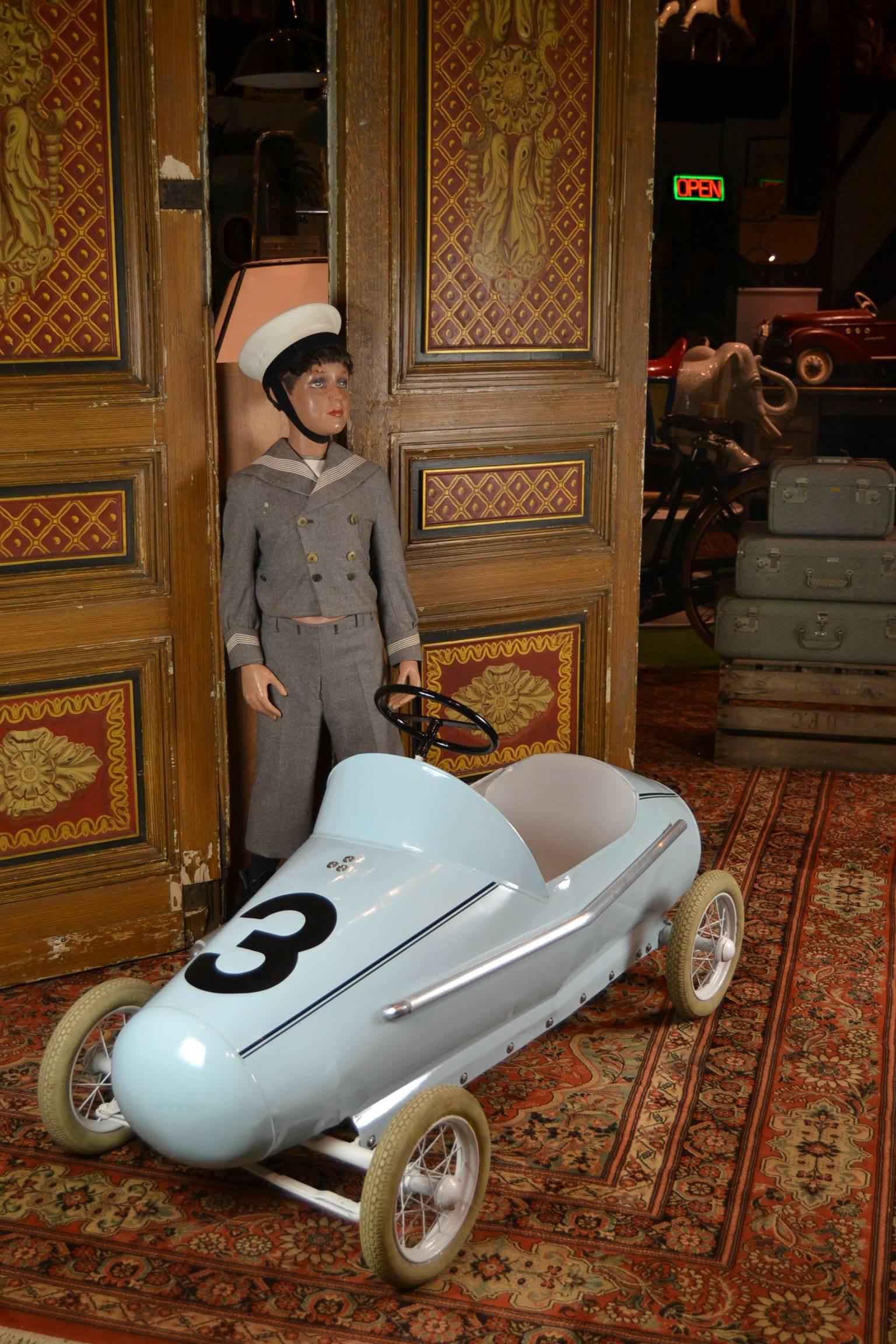Exceptional huge Racer Pedal Car.
A big heavy solid metal pedal with chain drive car made by Torck, 
a famous Belgian Toy Factory. 
It was handmade in the 1950s and still in very good used condition.
Those days this type of pedal cars were also