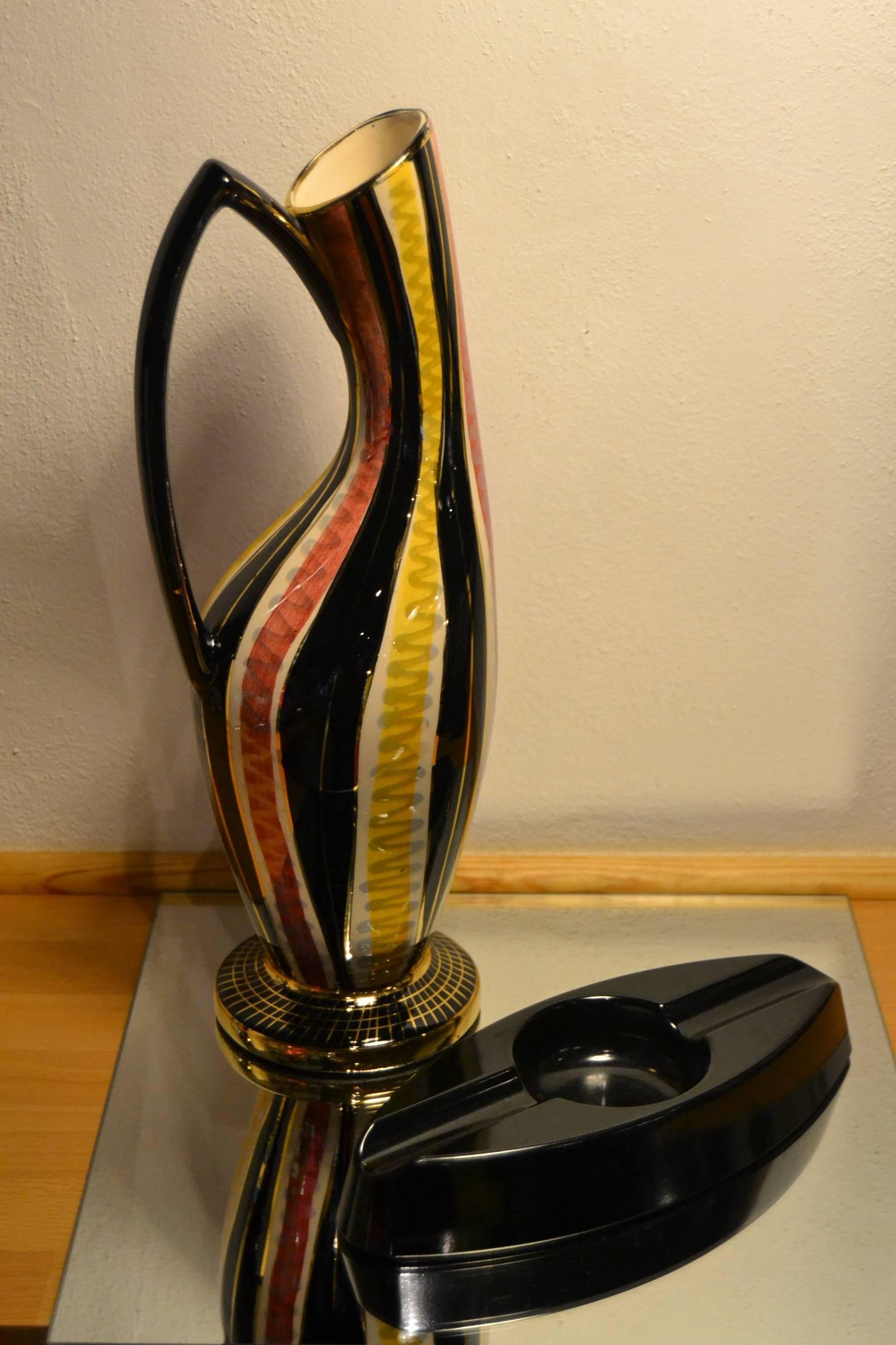 Mid-Century hand-painted ceramic vase by H. Bequet .
Beautiful use of colors black, gold, yellow, dark pink and gold rims. Typical design for the late 1950s - begin 1960s - expo 58 style. 

H.Bequet started his own company at Quaregnon (Belgium)