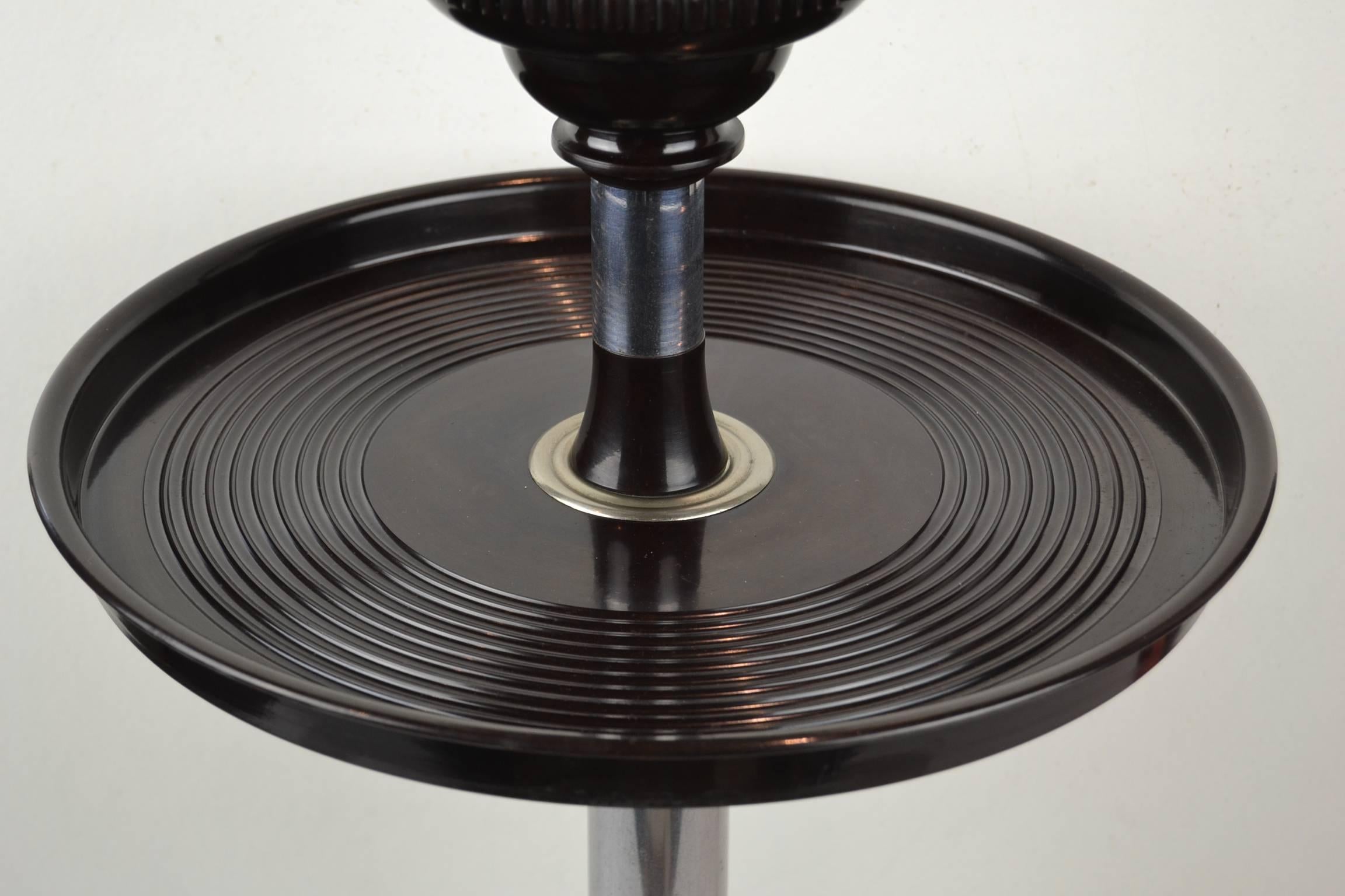 Fantastic smoking table - smokers stand - smoke stand.
This ashtray table dates, circa 1930 and can be described as Art Deco. It's made from Bakelite and chrome and is still in very good condition. No damages on the Bakelite. This side table with
