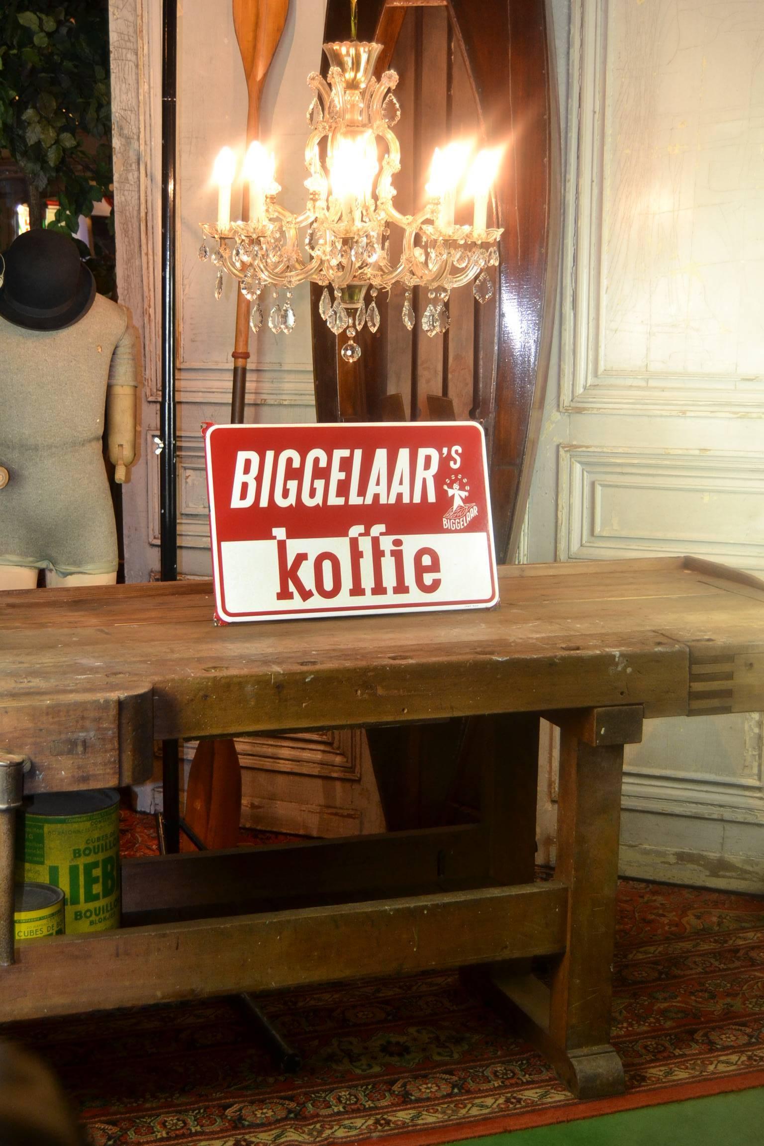 Mid-Century enamel sign - porcelain sign - advertising sign 
for Biggelaar's koffie - Coffee Netherlands.
Coffee roaster company (1884-1983)

This red en white square advertising sign was made in the 1950s 
by Langcat Bussum, Holland.
It has