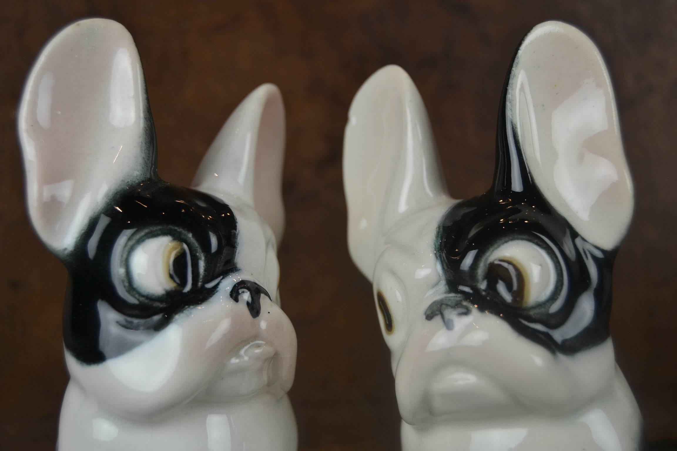 Set of two French Bulldog, Boston Terrier figurines.
Vintage porcelain dog figurines.
Caricature statues with very long ears and big eyes - two dogs in love.
The left Frenchie has been hurt on the tail and has a little chip on the ear.
The right