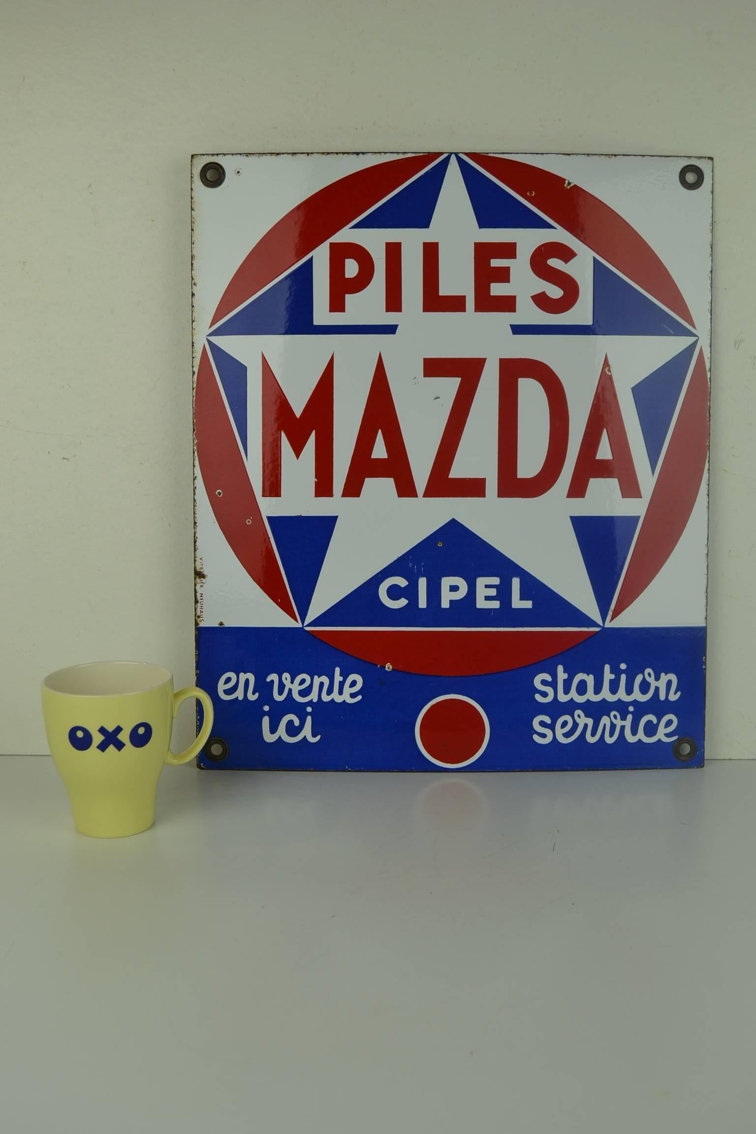 Vintage French Enamel Advertising Sign for Piles Mazda. 
This Porcelain Sign was made by the Enamel Factory Vitracier Neuhaus in France and dates from the 1960s.
This Publicity Sign for Batteries has the colors red, blue and white. 
 Mazda Piles