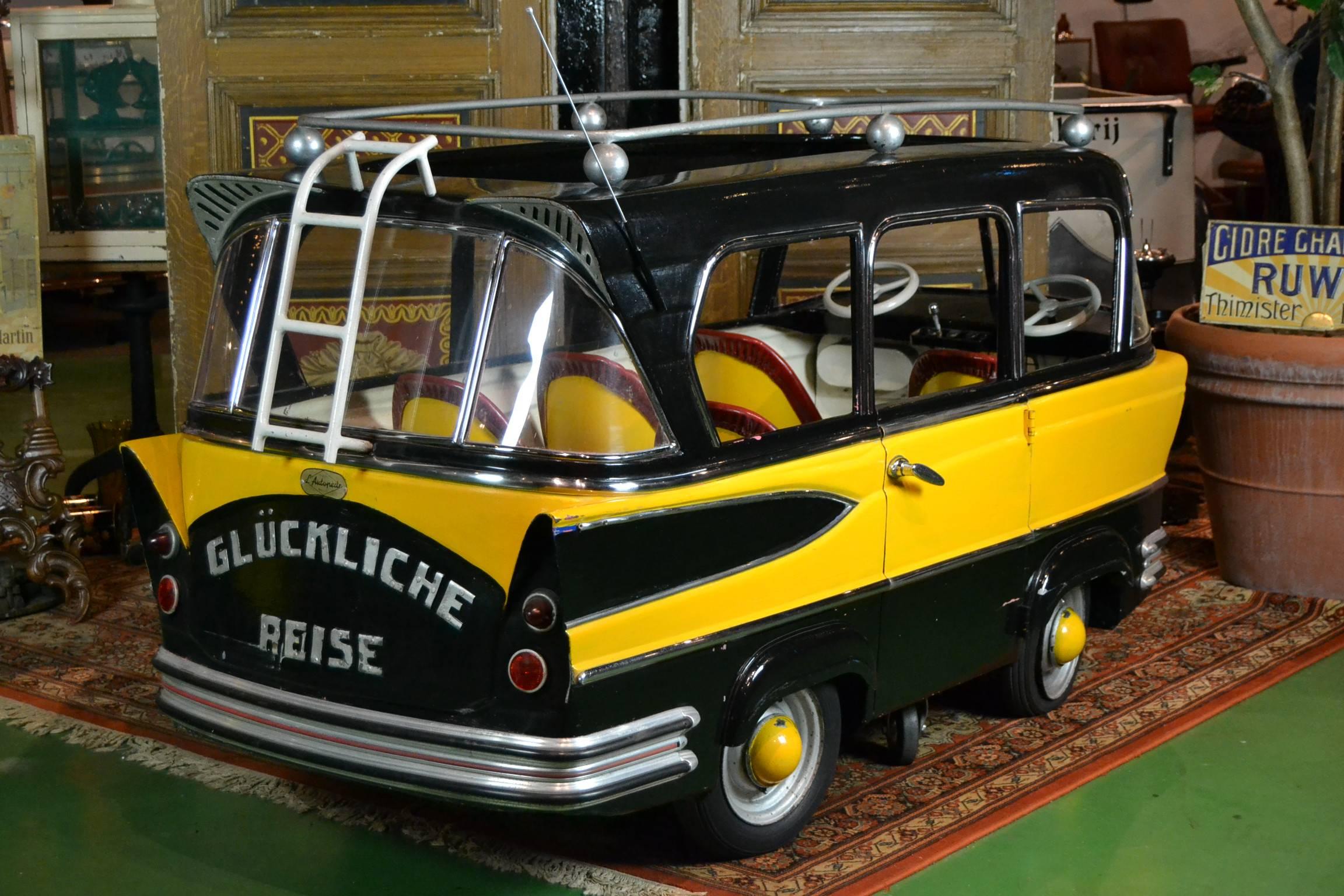 Stunning handmade metal ( ! ) one Door - children's carousel bus - Fairground motorbus made by L'Autopède Belgium 1950s.

This is the eldest version of this model made with Antenna. This was changed very quickly because it was too dangerous. When