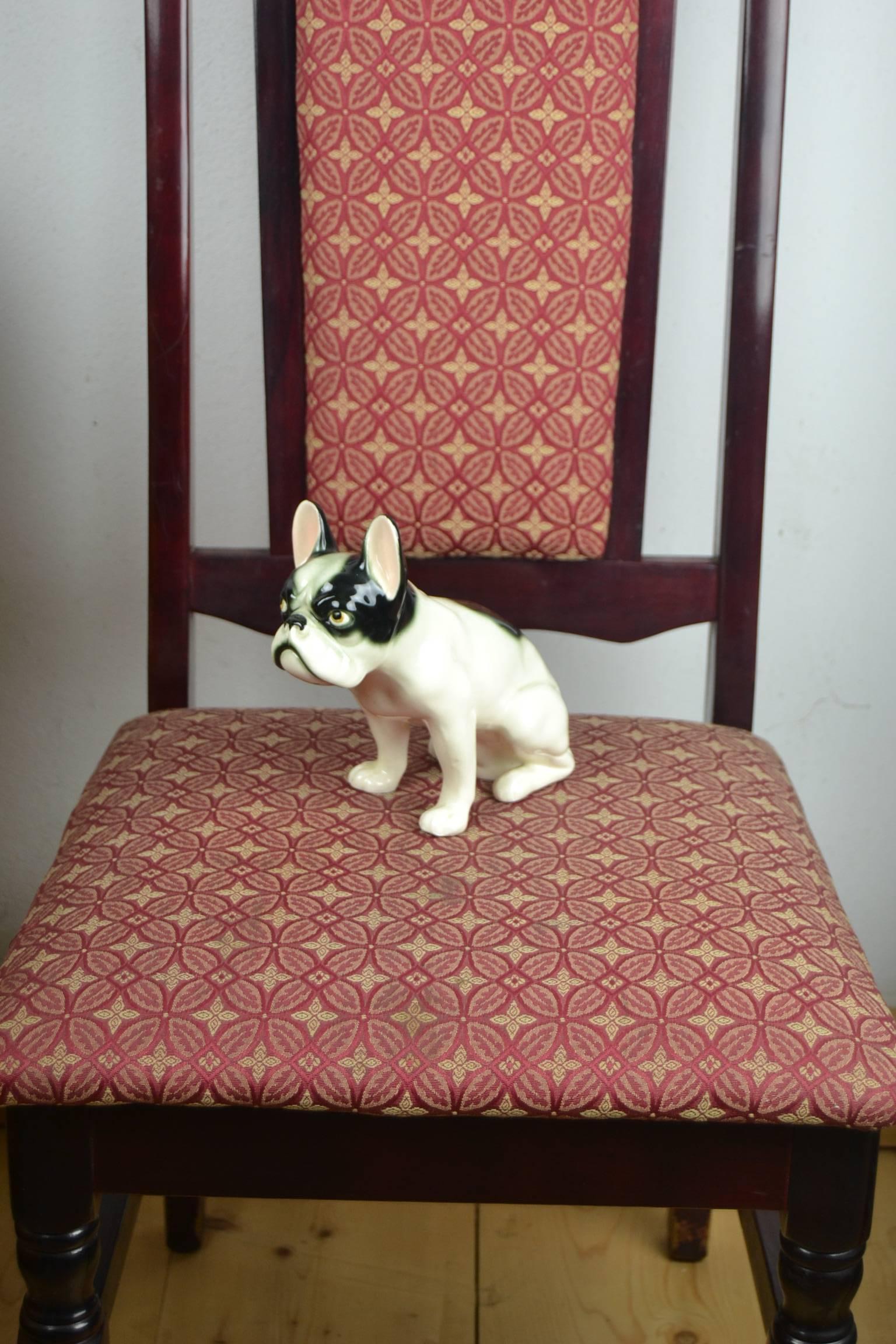 Antique big porcelain sitting dog figurine of a Grumpy French Bulldog or Boston Terriër.
Beautiful Art Deco porcelain statue from the 1930s made in Germany. 
Minor chip on one ear.
Numbered figurine.
Manufacturer unknown.

