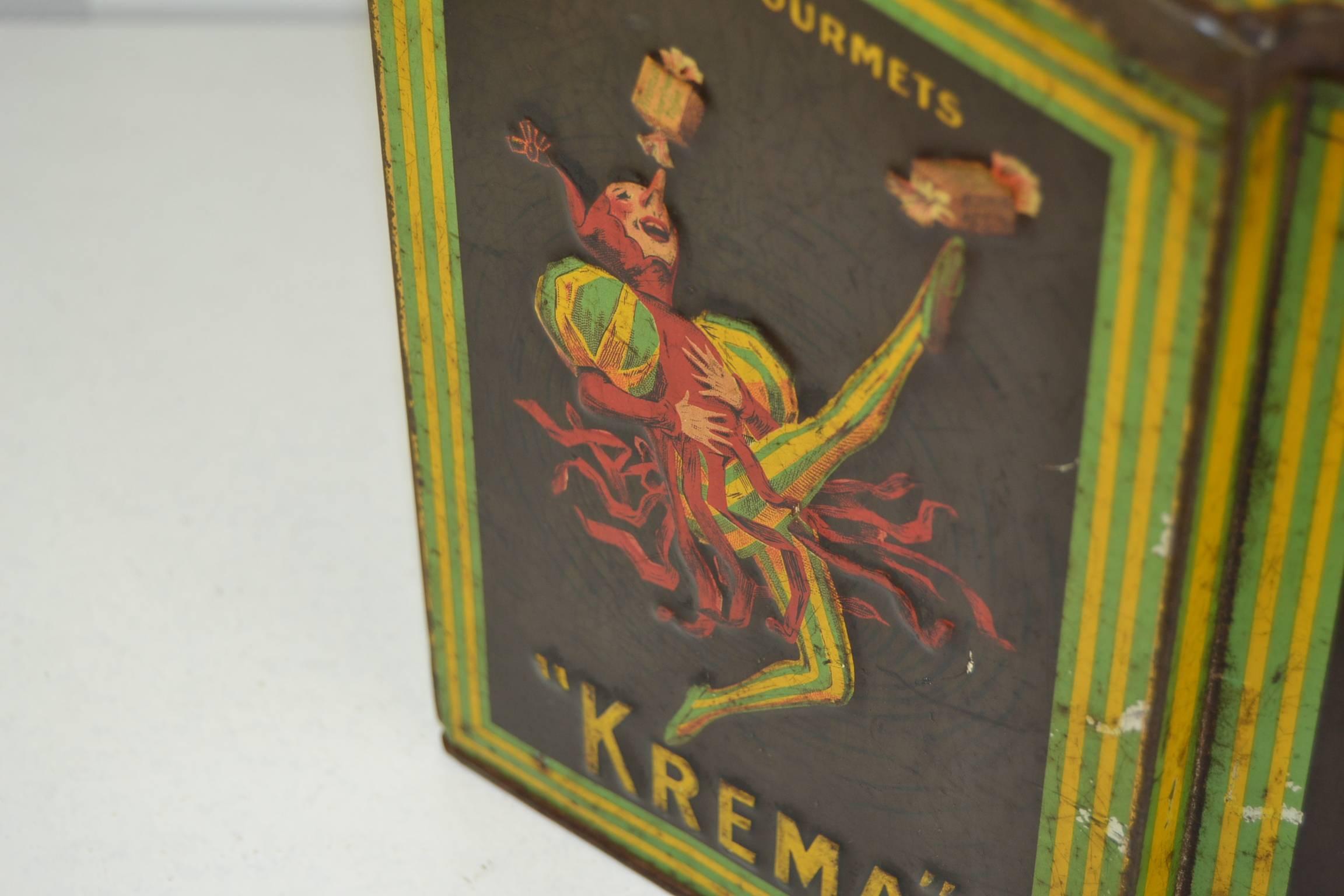 Krema Bonbons Confectionery Tin with a Jester , 
designed and signed by Jean D'ylen. 
This Antique Tin dates from the Early 20th Century and was made for the French Brand Kréma, who made the best Super Cream Toffee or Le Meilleur Bonbon au
