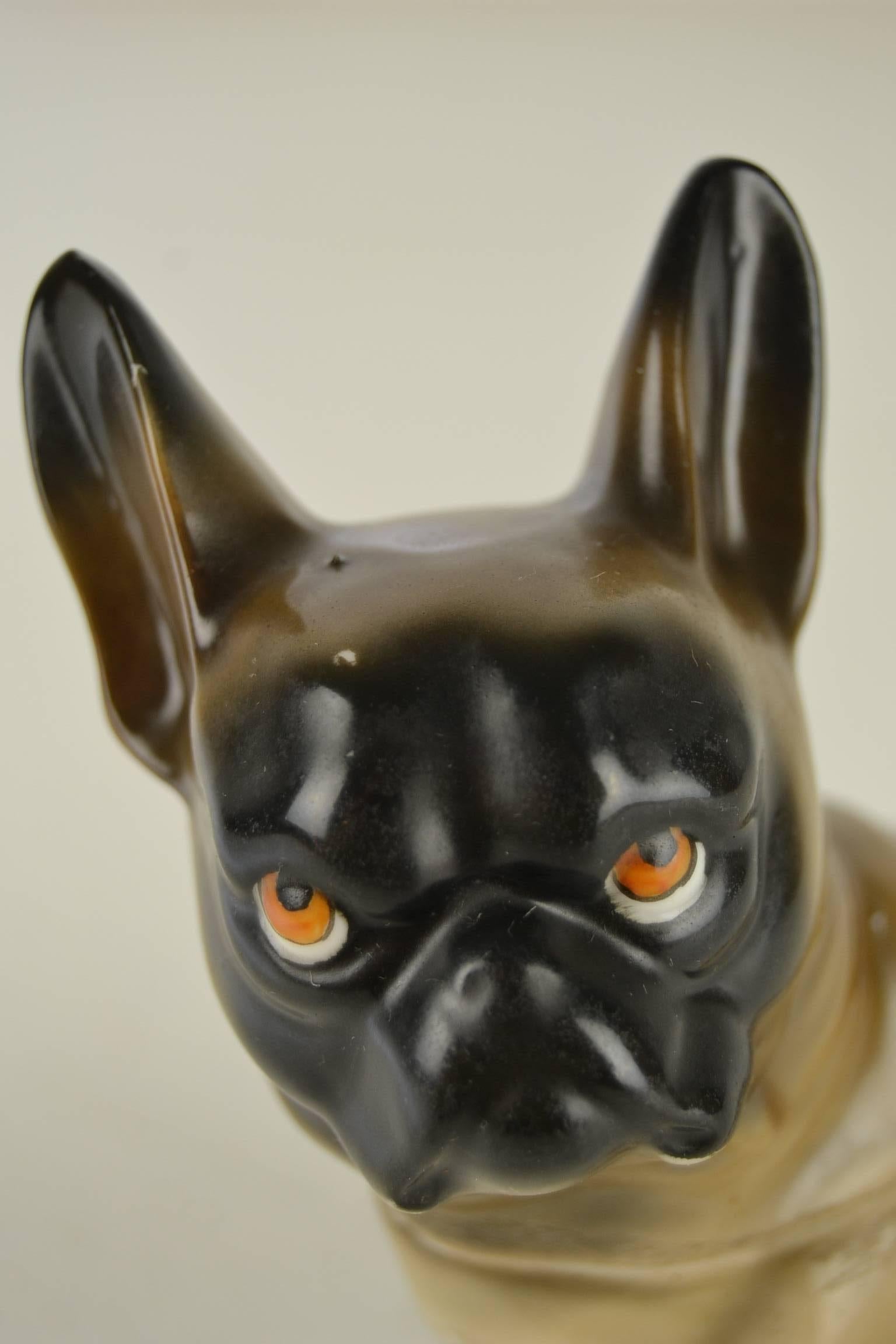 Art Deco Black Masked French Bulldog Humidor for loose tobacco. 
This German Porcelain french bulldog sculpture dates from the 1930s. 
Bulldog Figurine with black mask and grumpy tri-colored eyes.

You can take the head off to storage tobacco or can
