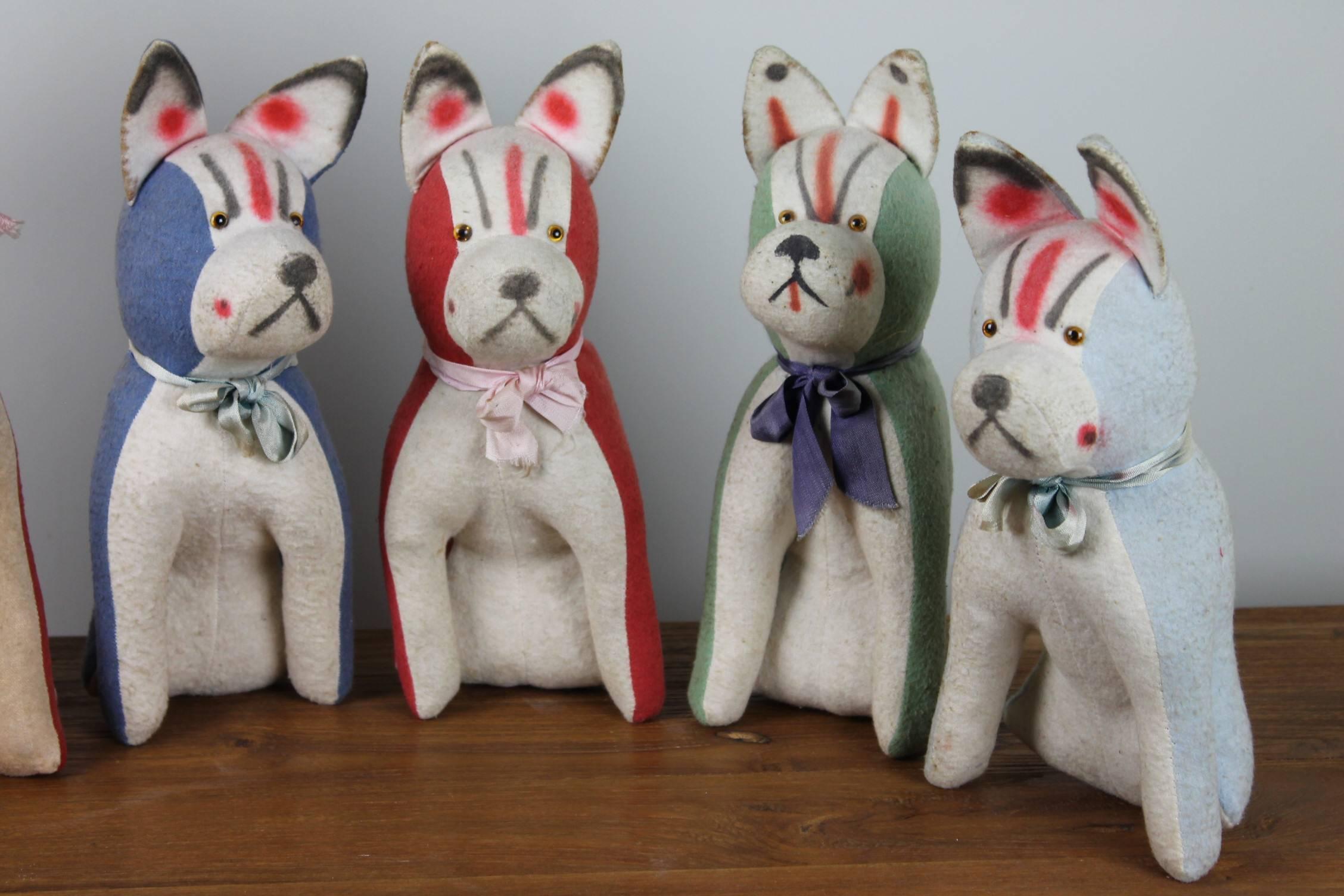 Set of 5 German stuffed Fabric Frenchies - Bully's - French Bulldog Figurines Toys -handmade in the early 20th-Century. 
They are stuffed with straw and are still in very good shape.  
Multi colored group of Toy Dogs.
Lovely Decoration Pieces or Dog