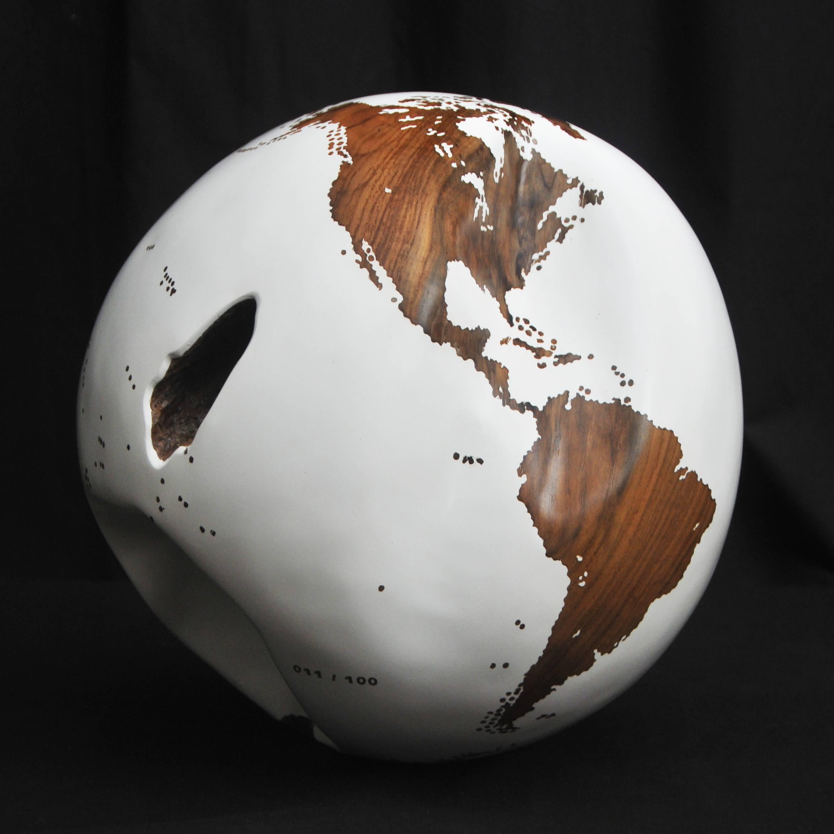One of a kind globe
Hand-carved in a solid piece of teak root
Finishing: Mirror dust
Mounted on turning base.
 