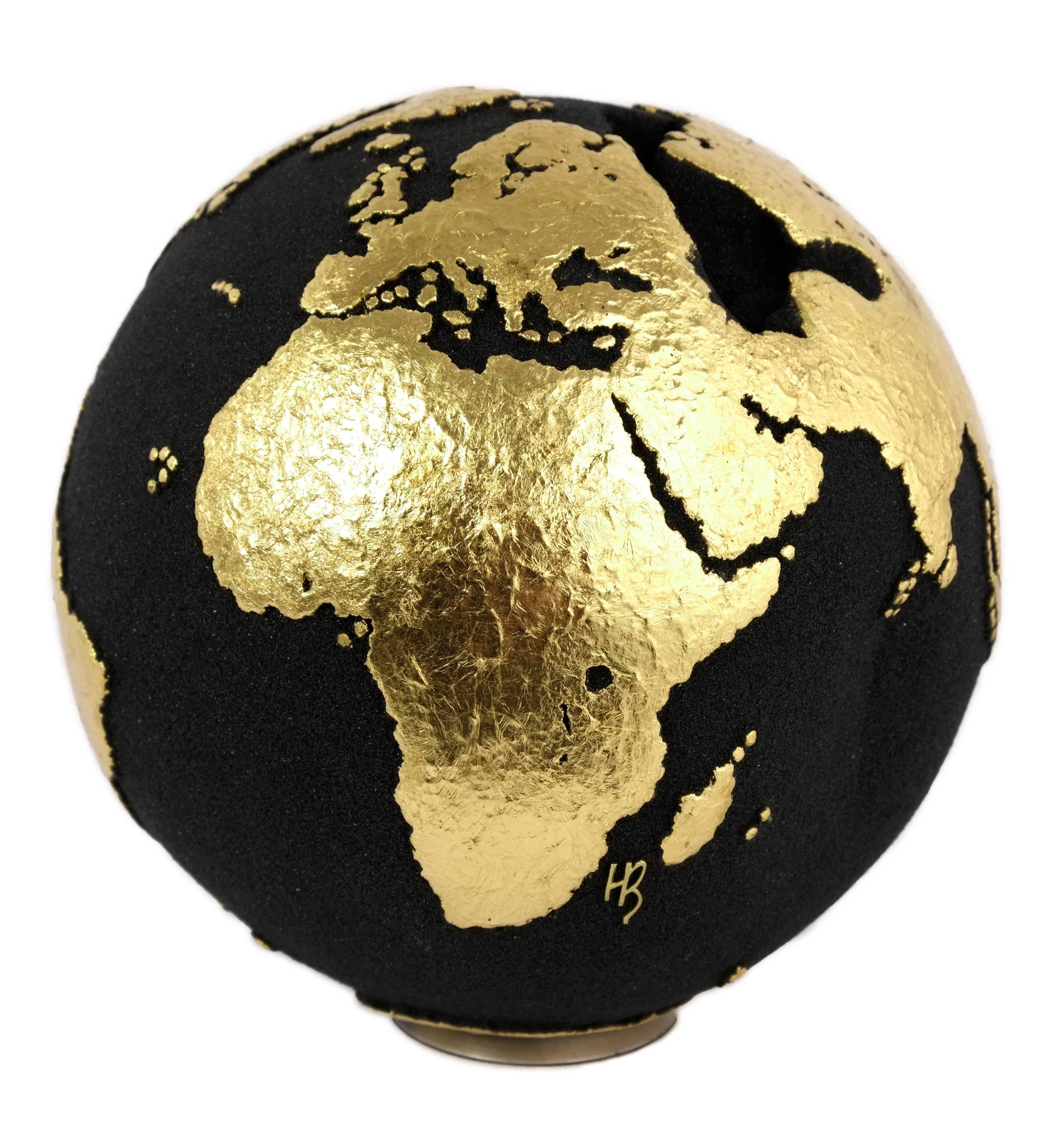 Say it with gold.

Adorable little handcrafted wooden globe made of teak root and volcanic sand, with 23-carat gold leaf finishing. A certainly ideal piece as gifts for friends, loved ones, or for yourself.

Dimension: 9.84 in / 20