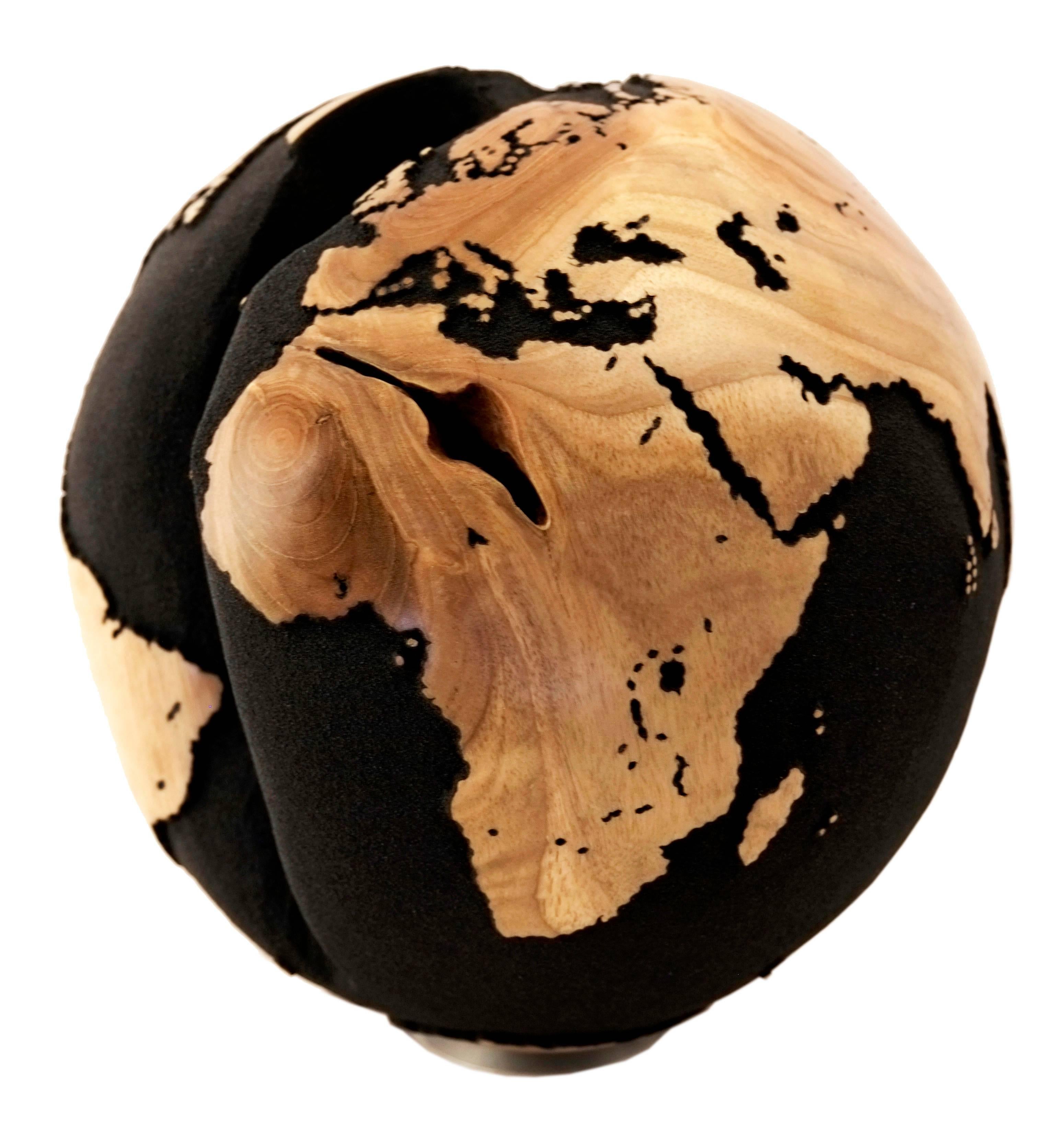 There is a crack in everything, that's how the light gets in.
From our Classic series, we present hand-carved wooden globe from reclaimed teak root with volcanic sand and interesting natural crack shape in the middle.

Dimension: 11.81 In / 30