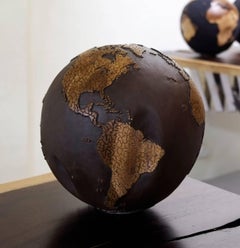 Teak root globe with cracked continents / gun finishing