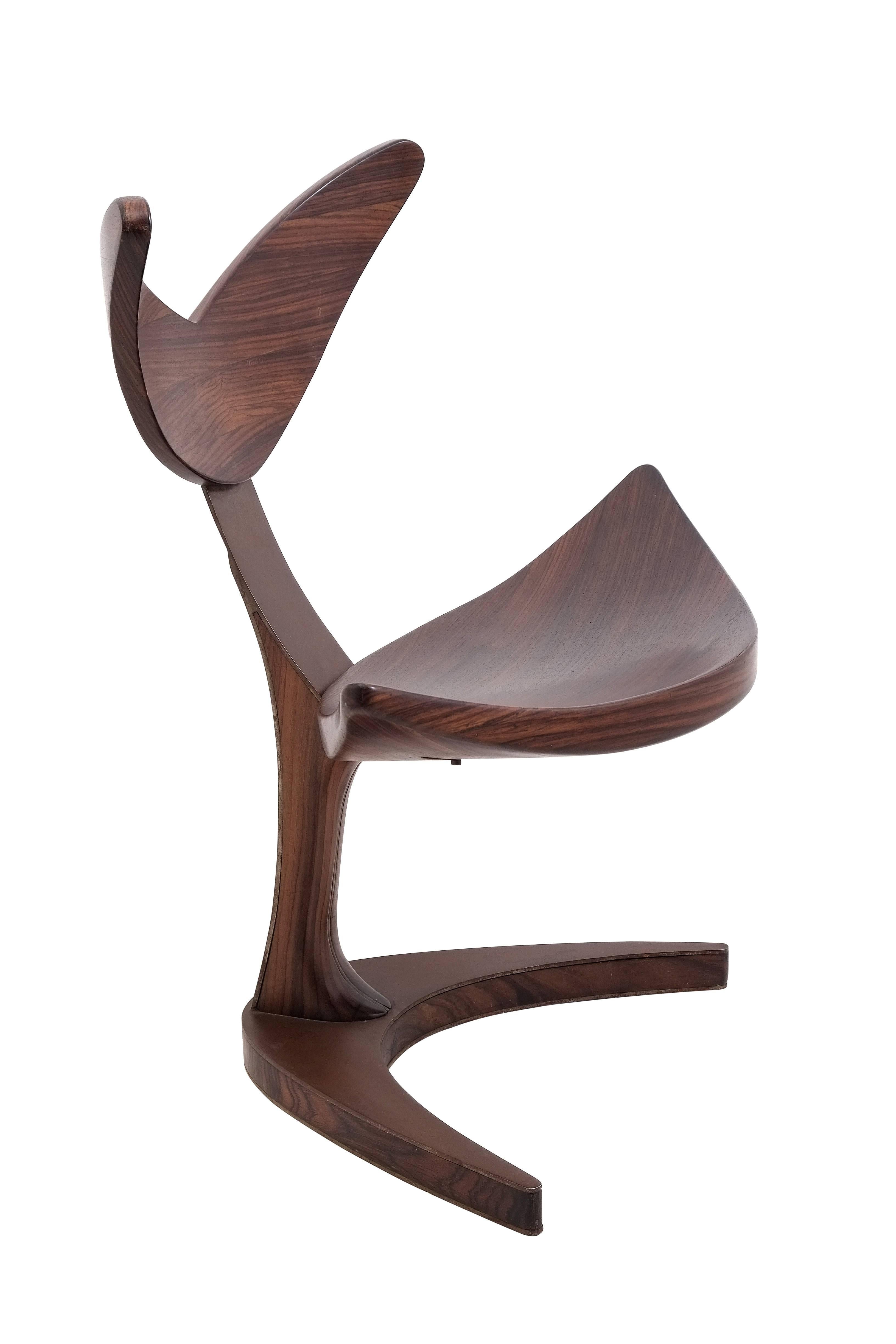 If you rest, you rust.

Unique chair inspired by whale tail made of plywood layered with 5 mm rosewood veneer, the rusty effect on steel legs and support create a vintage look, whereas its slim and elegant design make it fits into modern themed