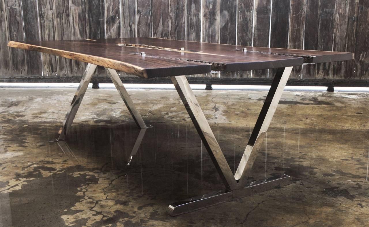 Exceptional handcrafted table made of Rosewood and mirror polished stainless steel. A creative blend of simple natural and contemporary design by Bruno Helgen.

Dimension:
Outer: 216.5 (D) x 125 (W) x 74 (H) cm
Top Table: 216.5 (D) x 118 - 125