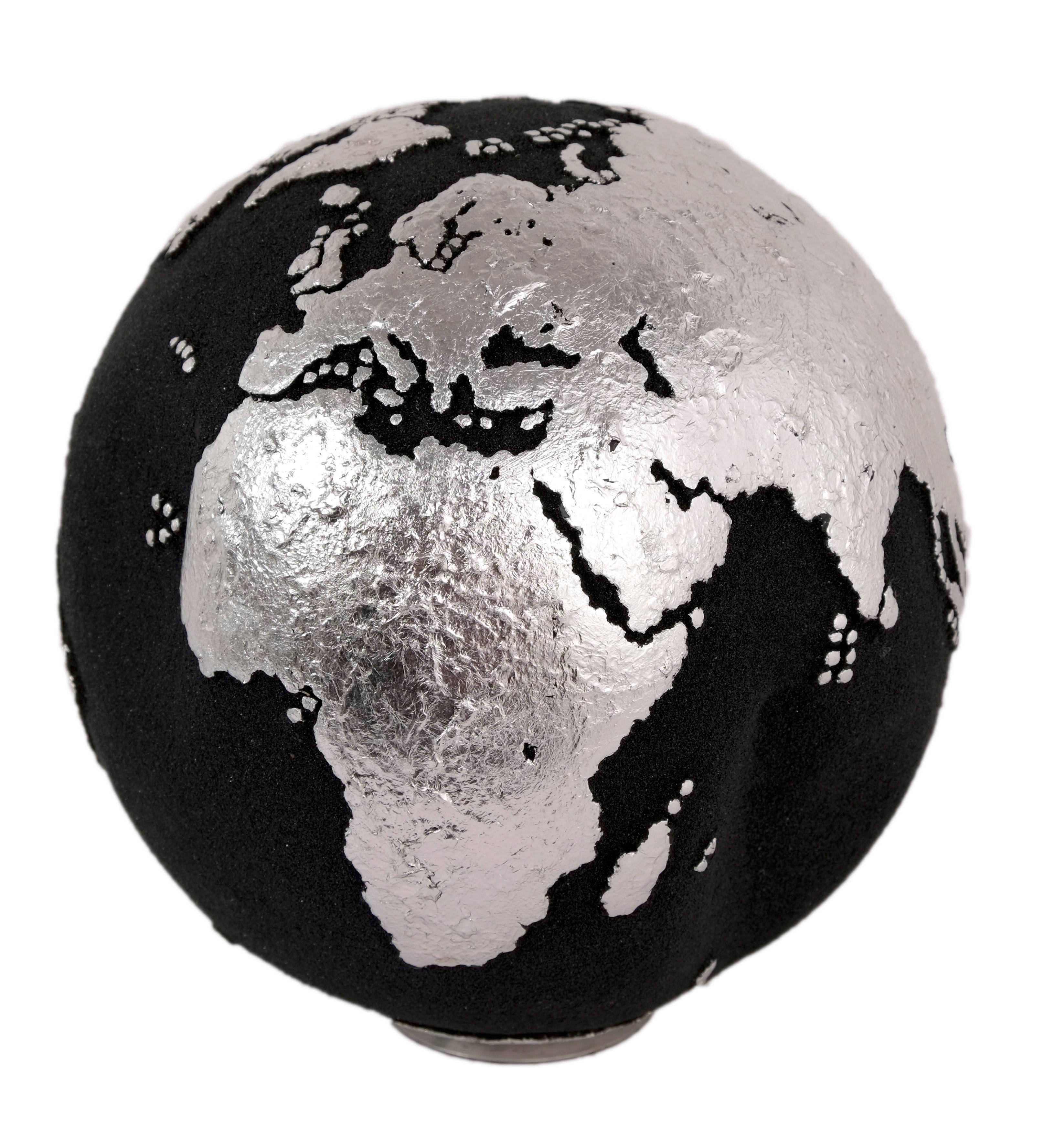 Small is great.
Small size hand-carved wooden globe made of teak root, volcanic sand, and silver leaf, this small piece is a great choice for minimalist themed decor.

Dimension: 9.84 In / 20 cm
Materials: Reclaimed teak root, volcanic sand and