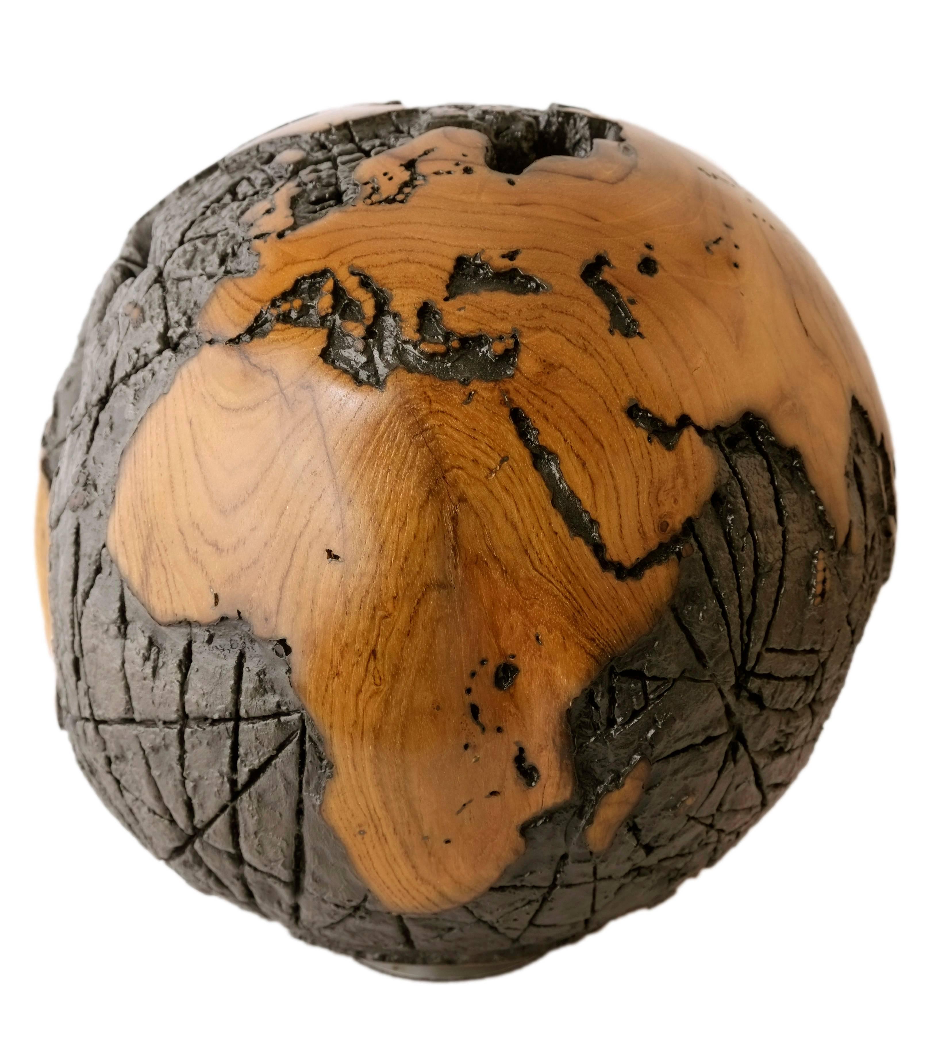 Iron, when heated and pounded, becomes a fine sword. Likewise, our true strength and potential cannot be forged without hardship.

Lava Flow, a hand crafted wooden globe made of burnt teak root, with viscous molten metal applique' finishing.
This