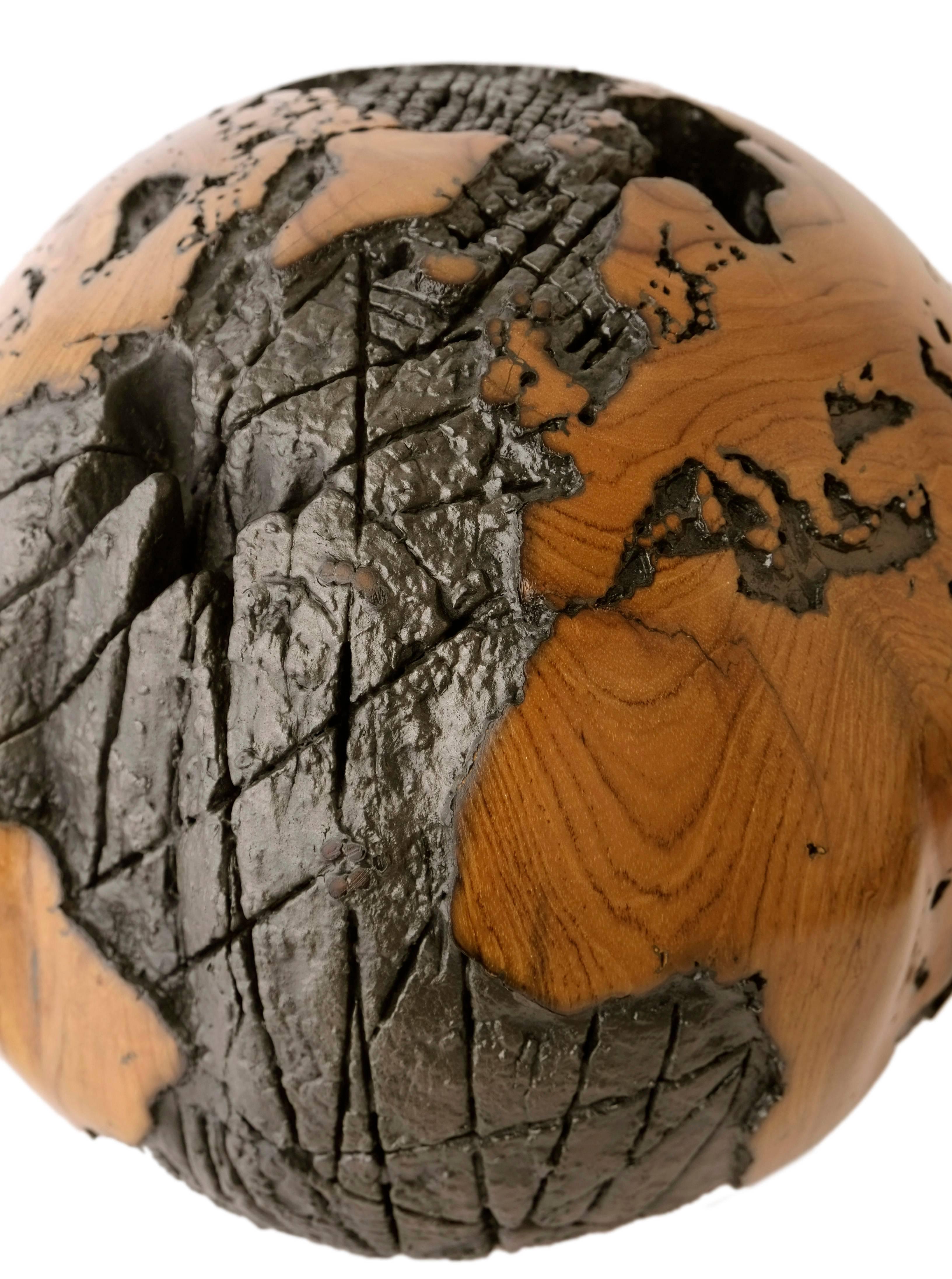 Organic Modern Wooden globe made of teak root and metal with cold lava flow texture, 30 cm