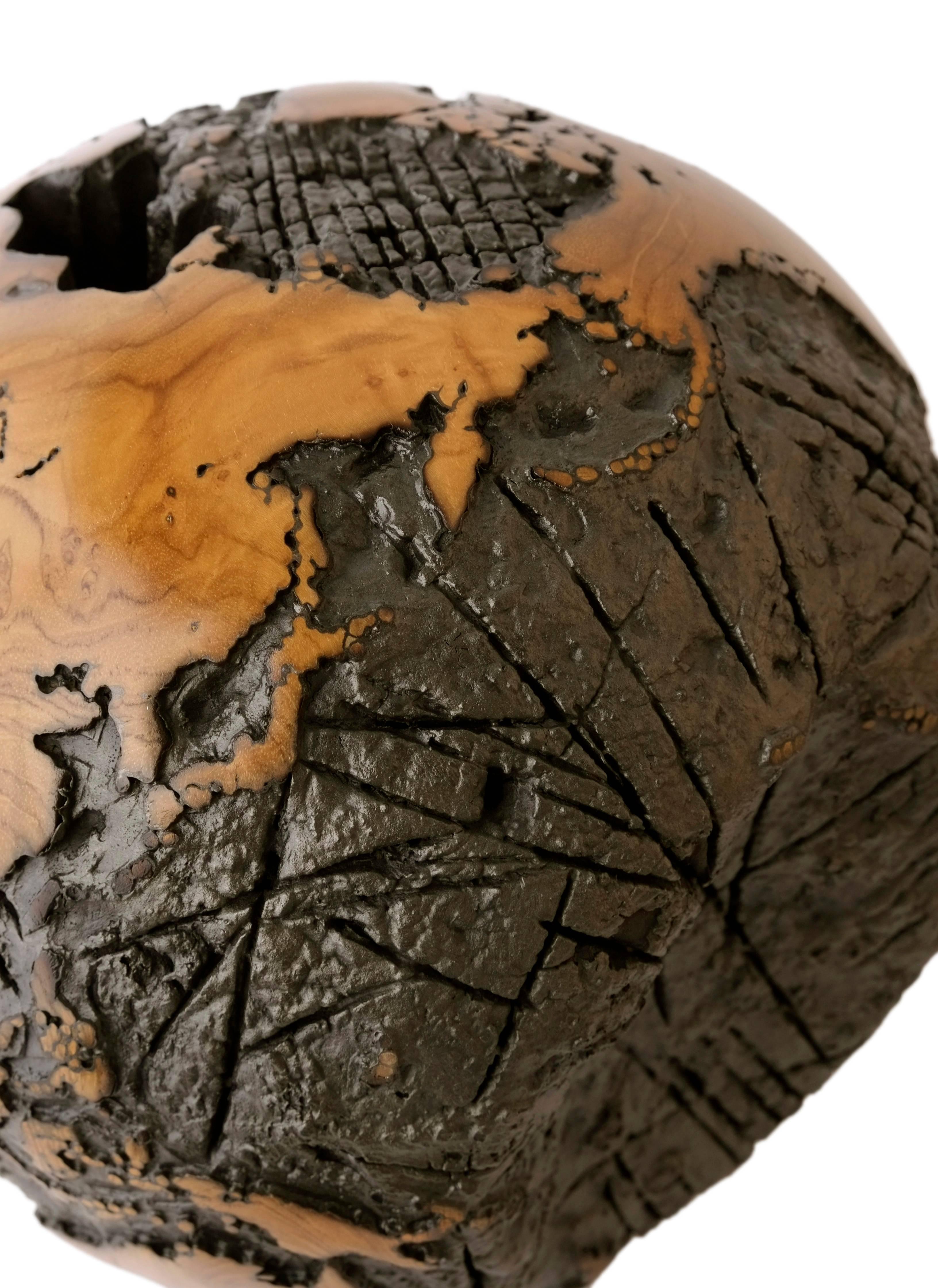 Contemporary Wooden globe made of teak root and metal with cold lava flow texture, 30 cm
