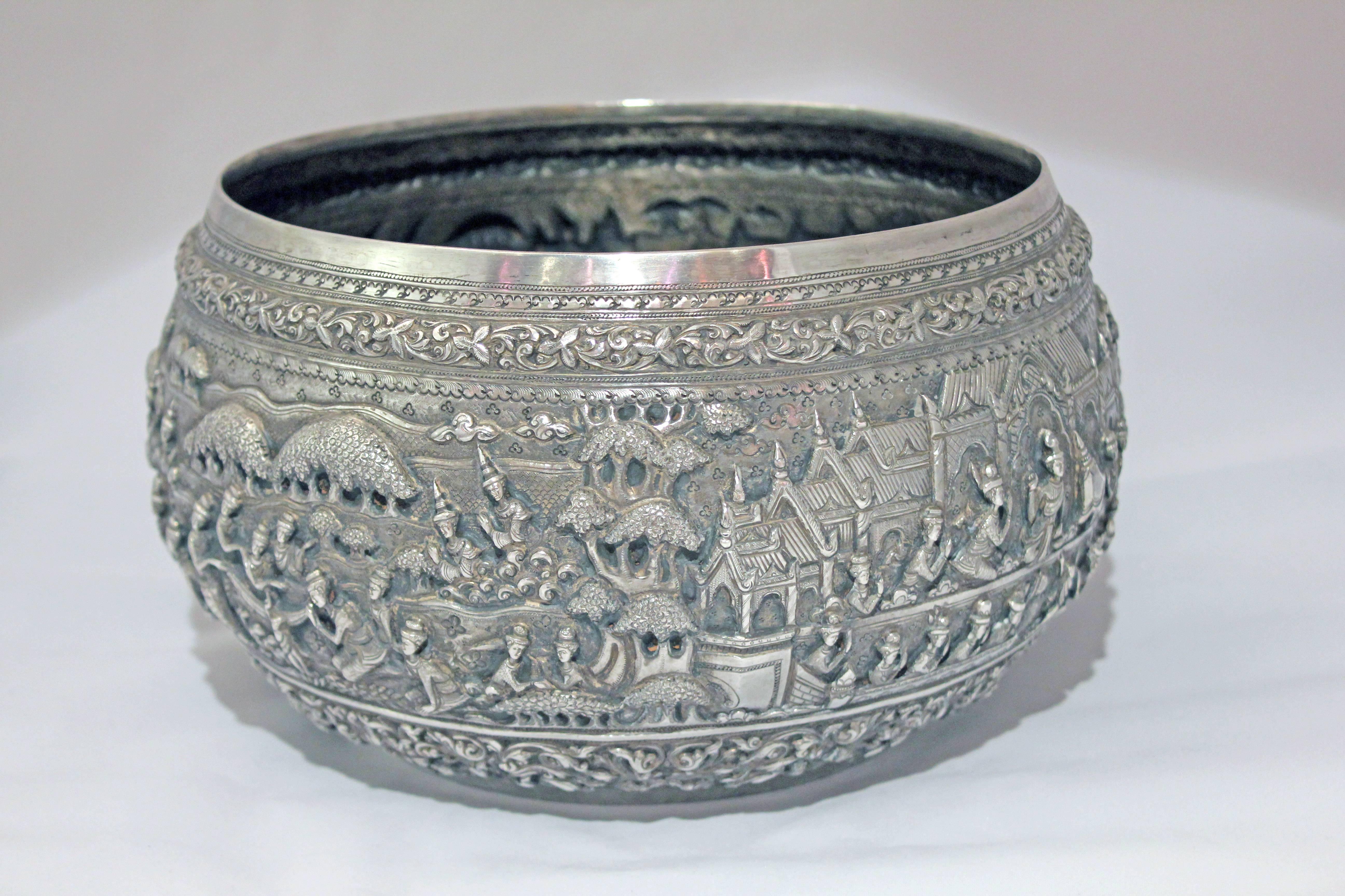 The silver bowl with finely chased details in high relief depicts scenes from the Jataka tales. These tales are moralistic tales, either from the lives of the Buddha or parables taught by Buddha. The rim and the base of the bowl are   finely