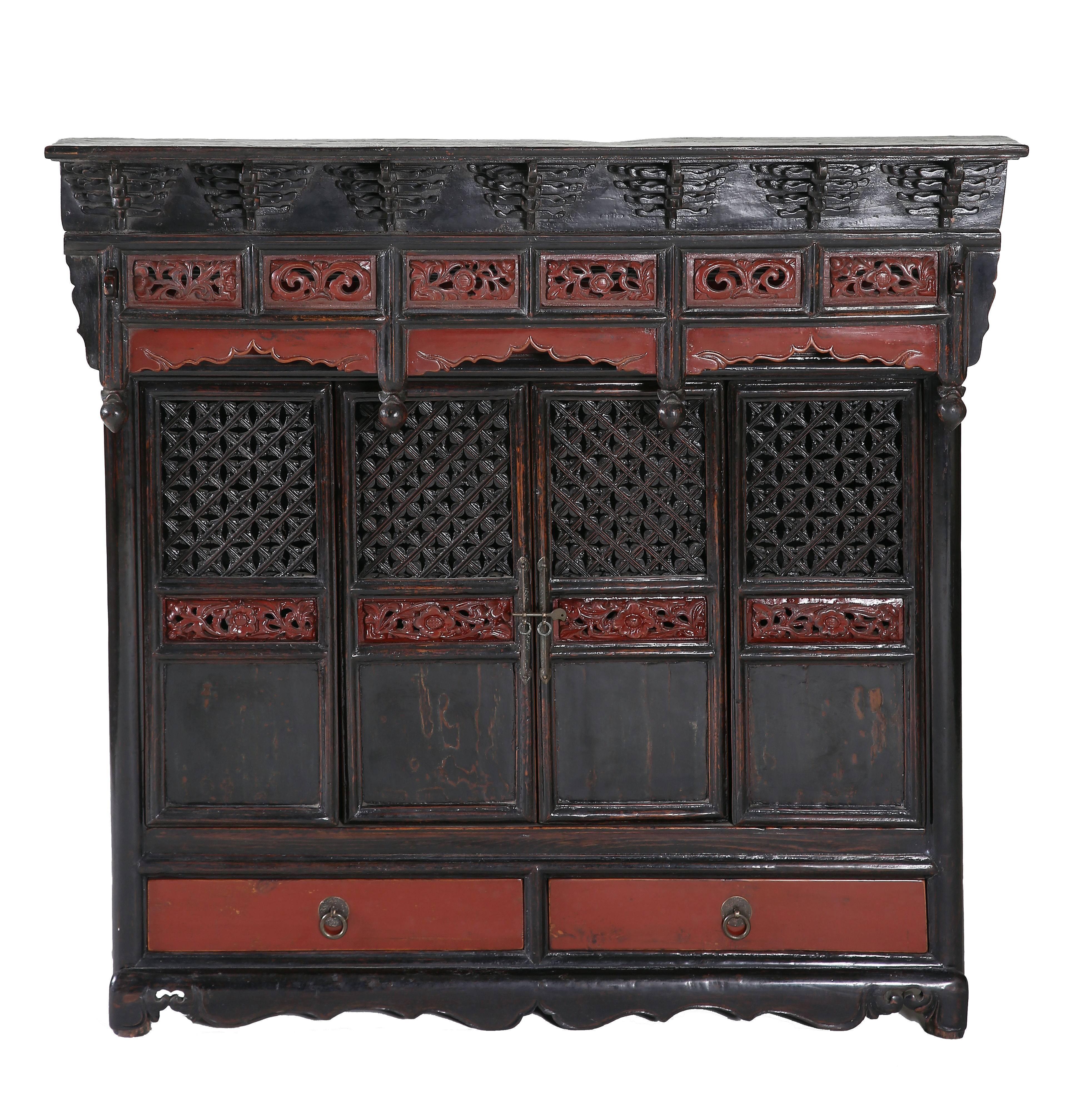 Exquisite table shrine cabinet,
the archaic, decorative and removable canopy composing of layered eaves above four overhanging vertical posts with lotus bud ends, spanned by taohuan panels of open-carved floral panels and cusped curvilinear aprons,