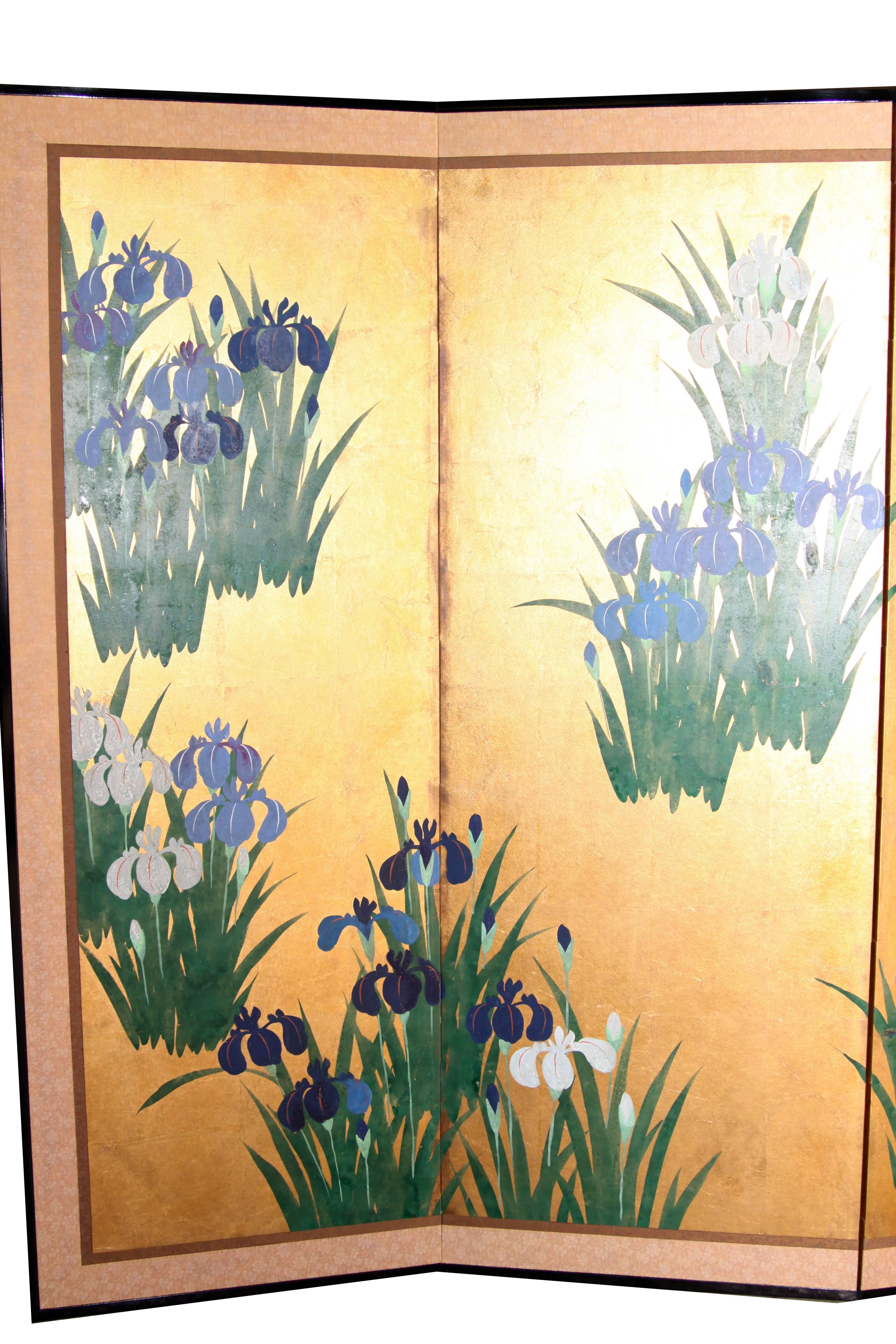 The scattered iris painting of this 4-panel screen is hand-painted in watercolor, on squares of gold leaf which are applied by hand to the paper base over carefully jointed wooden lattice frames. Lacquer rails are then applied to the perimeter to