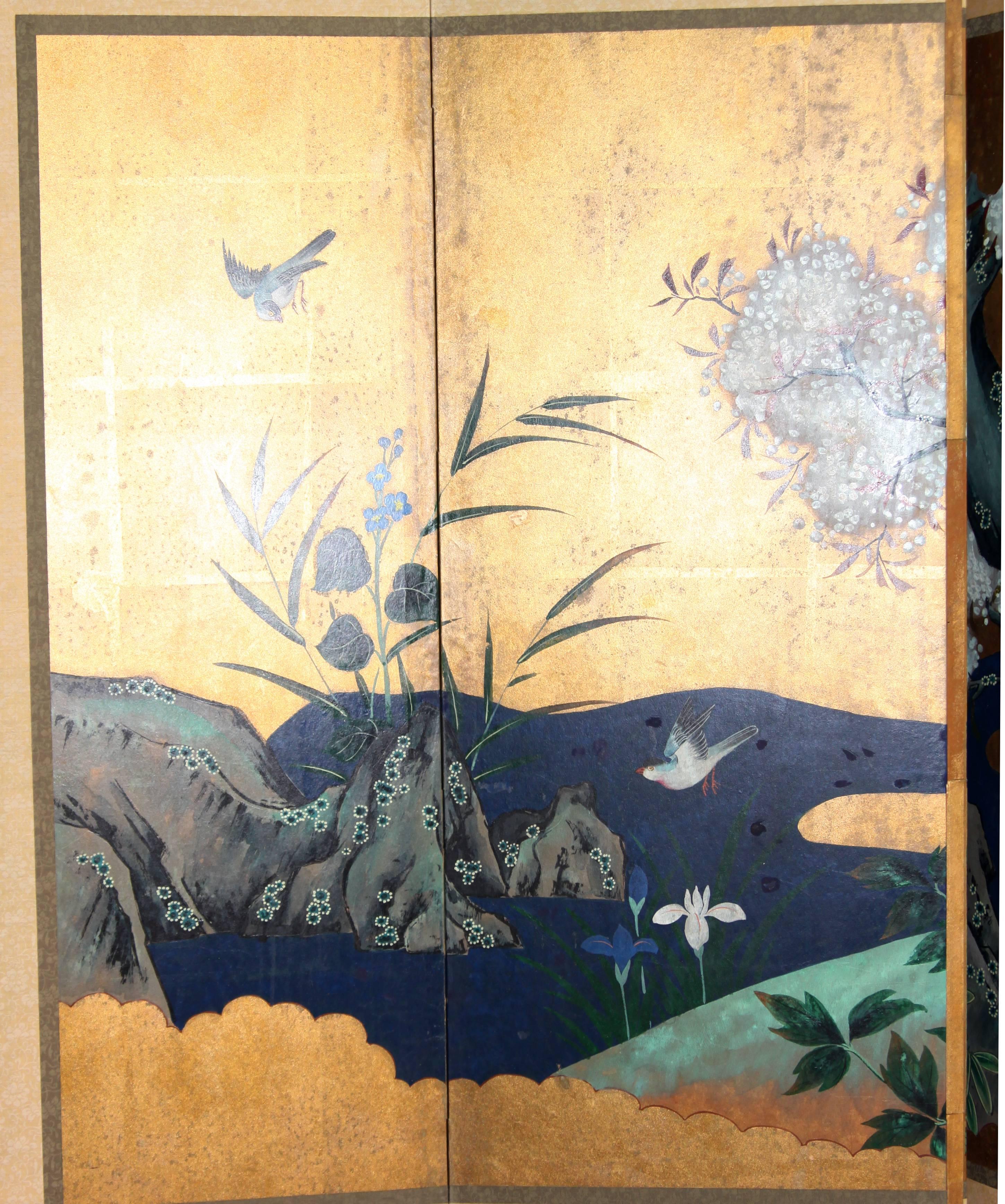 The spring scene painting of this six-panel screen is hand painted in watercolor, on squares of gold leaf which are applied by hand to the paper base over carefully jointed wooden lattice frames. Lacquer rails are then applied to the perimeter to