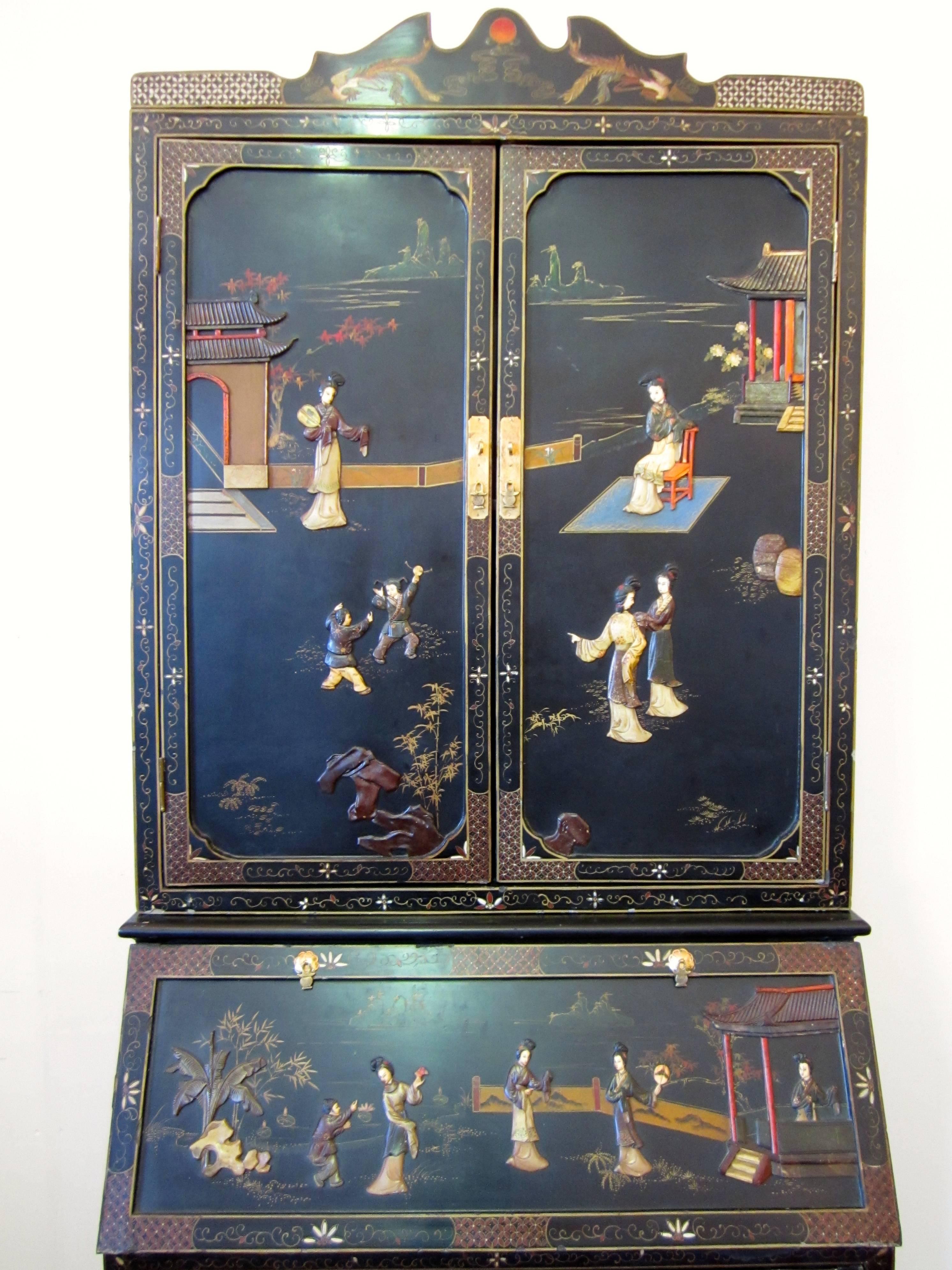 Chinese black lacquered wood cabinet with figures and village scenes made by steatite, semiprecious stones, bone and lacquered wood.