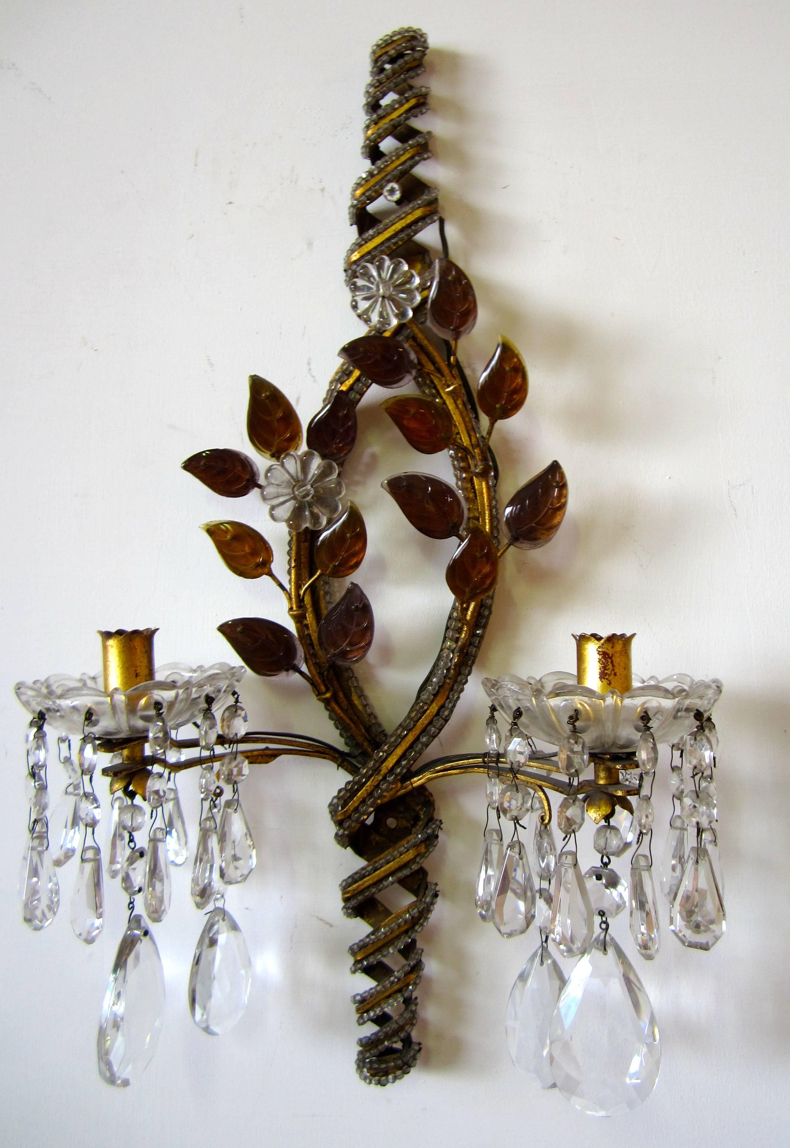 Pair of Maison Baguès gilt iron wall lights with glass beaded and leaves motif.