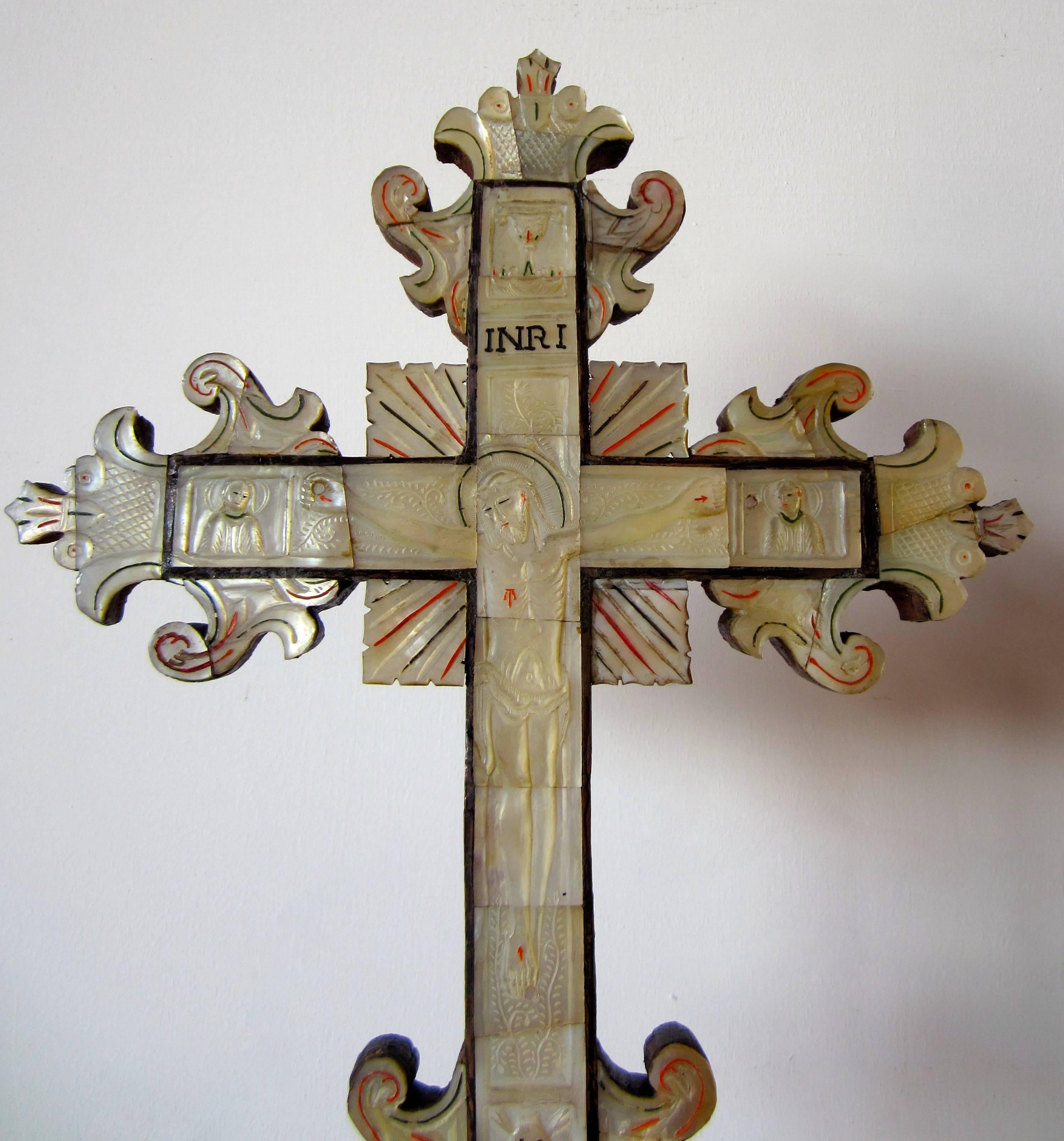 A hardwood cross, veneered with mother-of-pearl. Deep engraved the figure of Jesus Christ and the Virgin Mary, Jerusalem, 18th century.