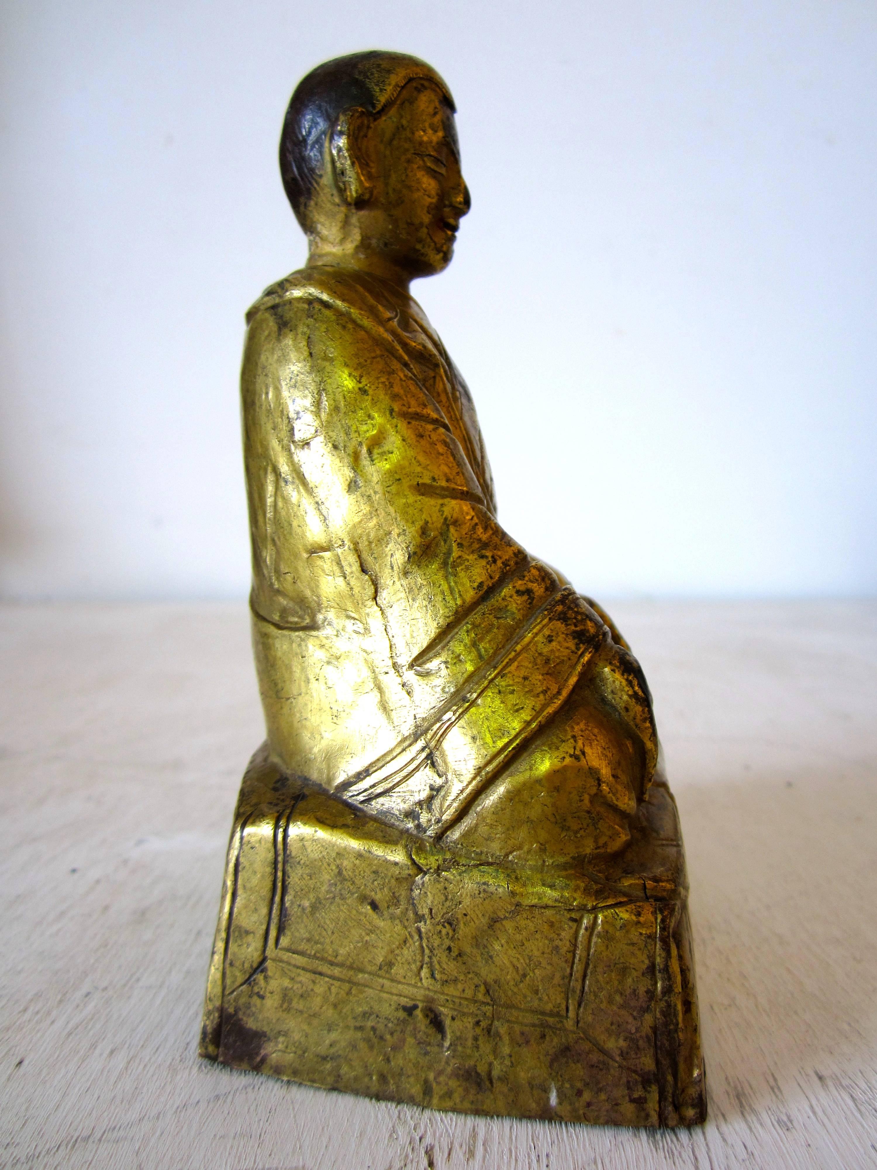 Tibetan Gilt Copper Repousse Figure of an Arhat 1