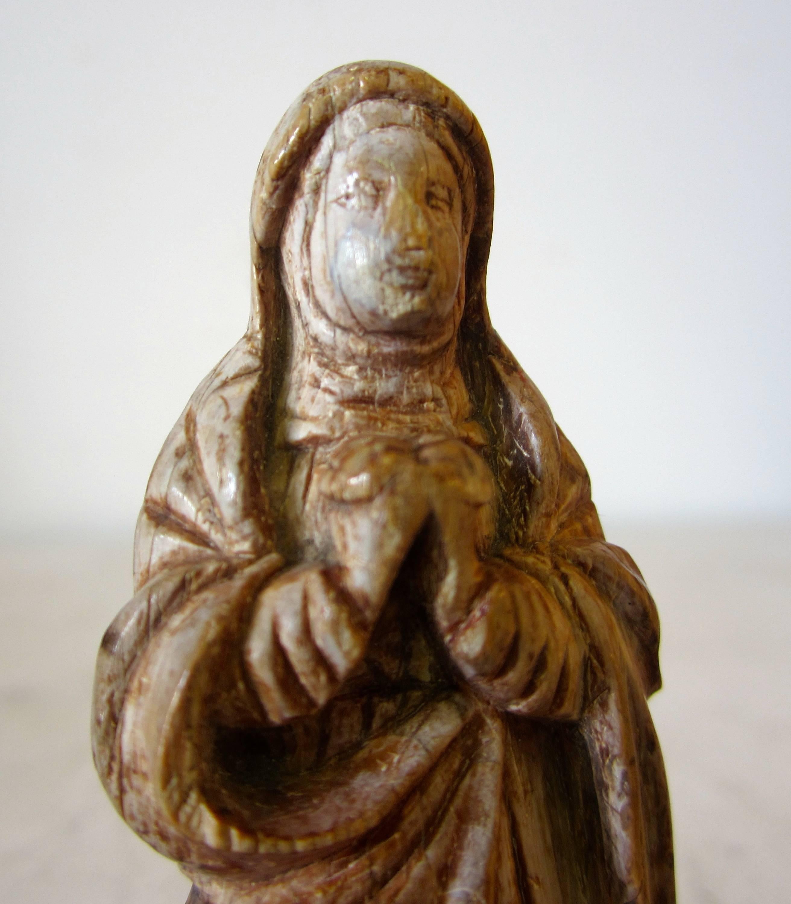 A small bone figure of Madonna. Quite smooth for the age, Goa, 17th century.