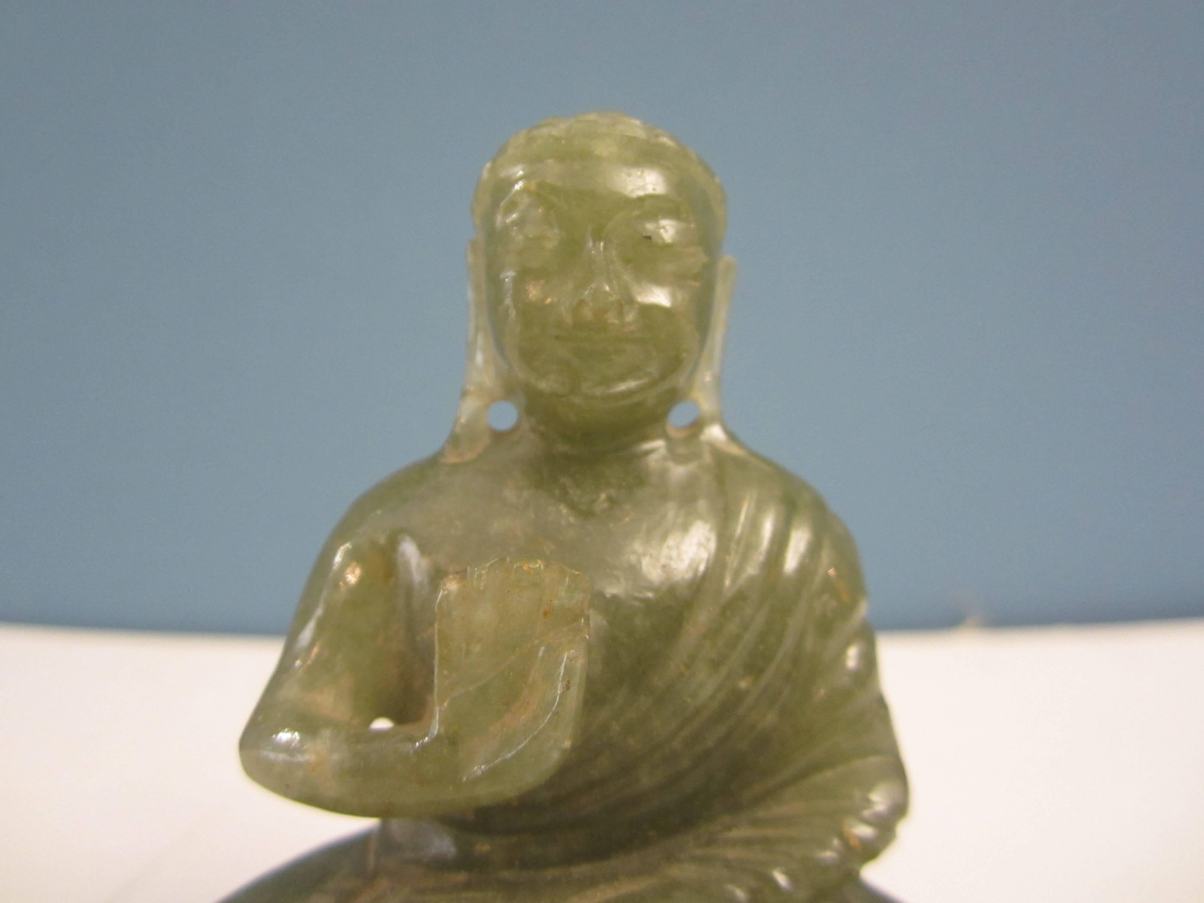 A small jade Buddha, India, circa 1950.