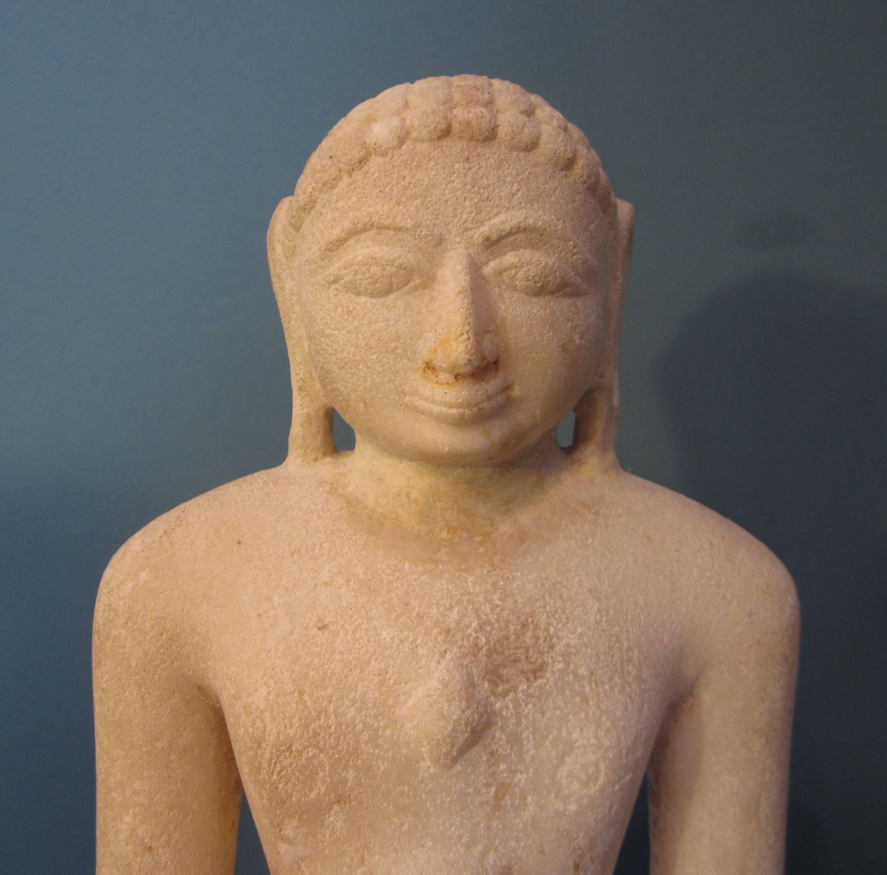 A marble seated Jina, inscribed and dated 1420 Samvat (1364 AD). Rajasthan or Gujarat, 14th century.

 