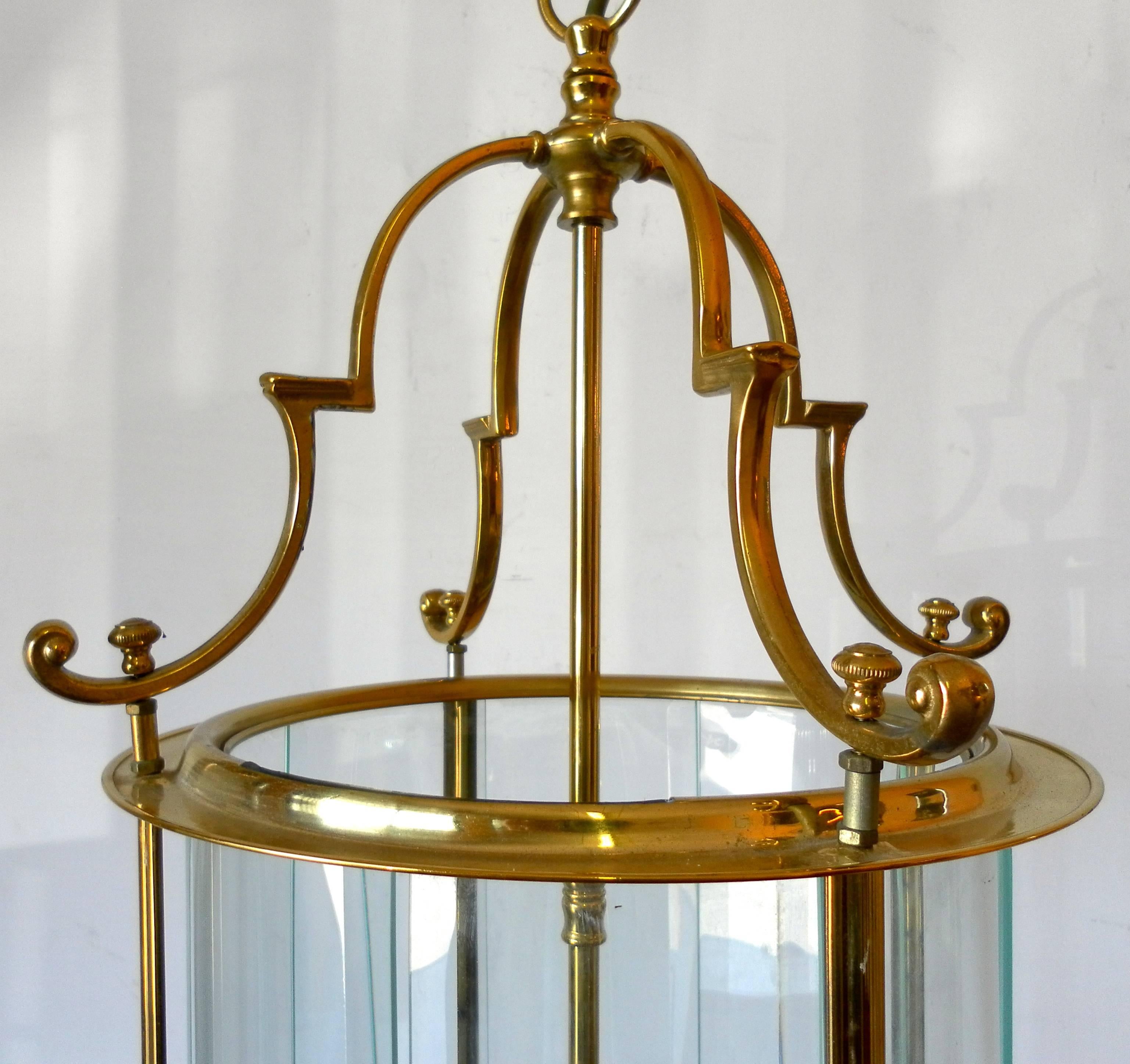 A Louis XVI style round brass lantern with cut-glass. Measures: Height 80 cm with chain, five lights, France, mid-20th century.
