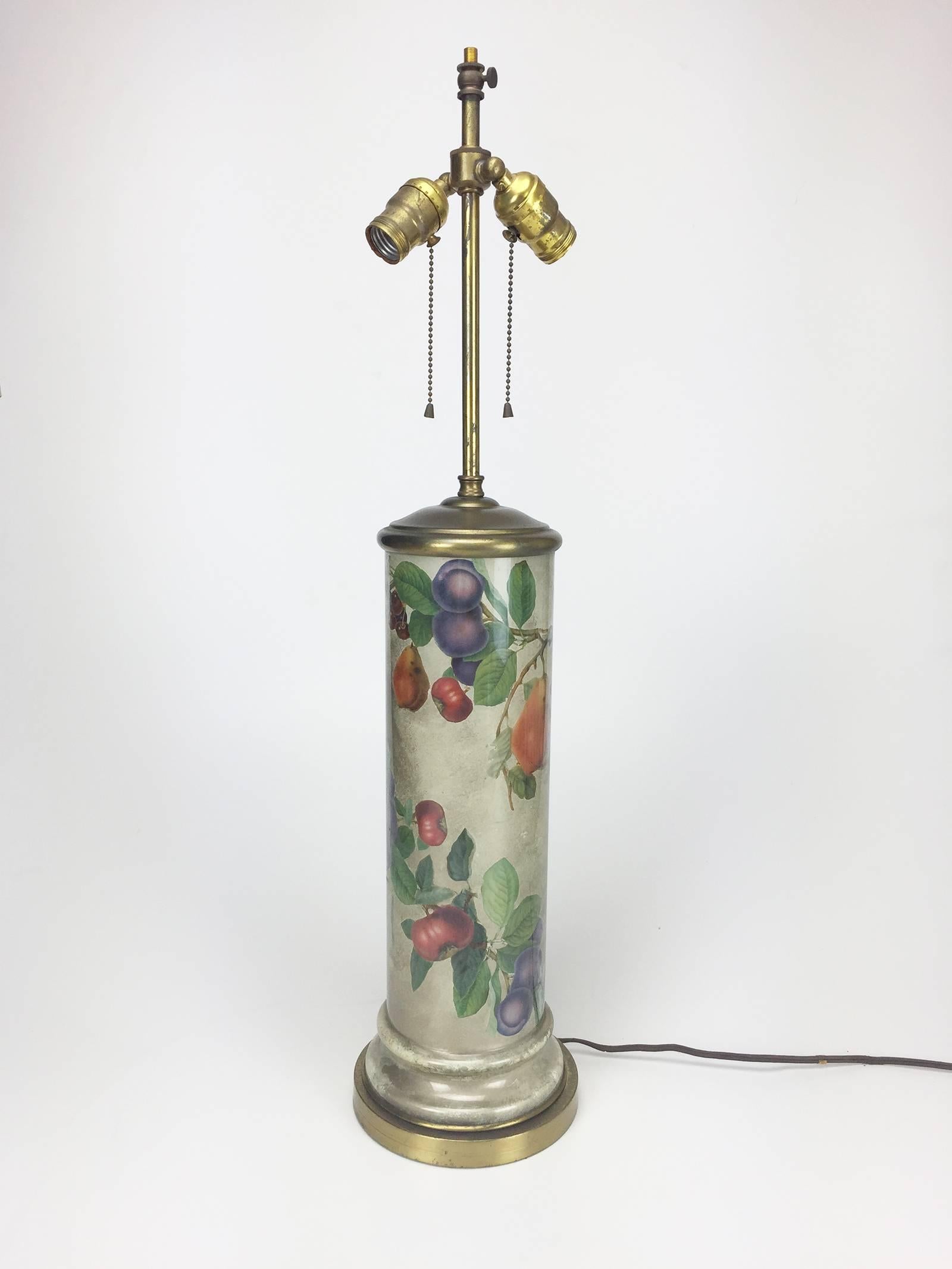 Tall table lamp with silvered body and decoupage floral and fruit design. Brass neck and base with double-headed fitting. Recently re-wired. Shade not included.