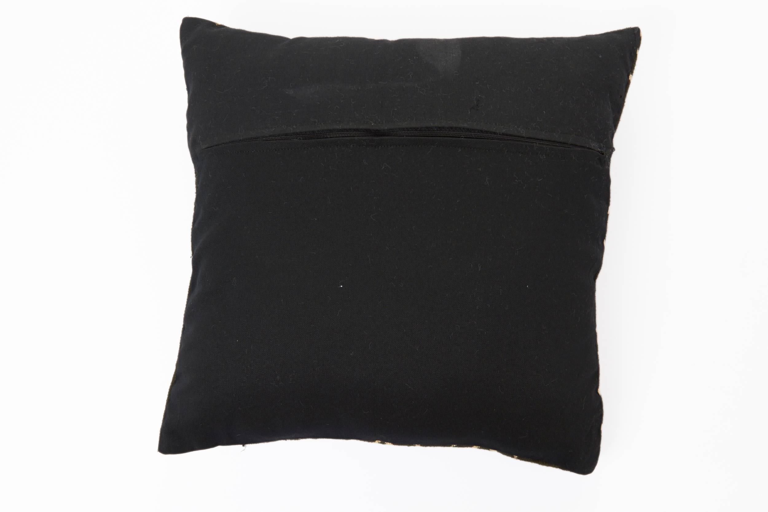 Gorgeous handcrafted African pillow out of authentic mud cloth with cream geometric tribal design over black background. Opposite side is solid black with zipper. 

Each measures 15 x 15 in. 

Perfect in pairs or individually. Four available.