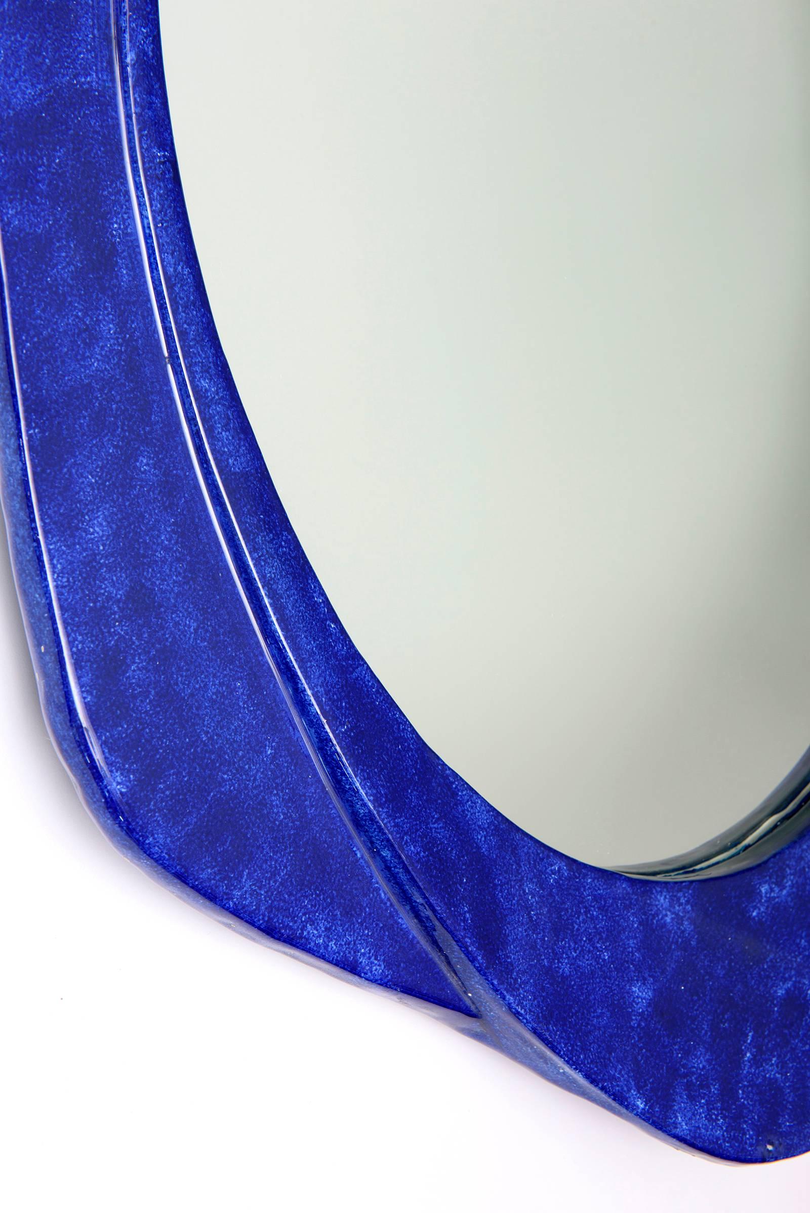 Italian wall mirror with beautiful royal blue mottled glazed ceramic frame.