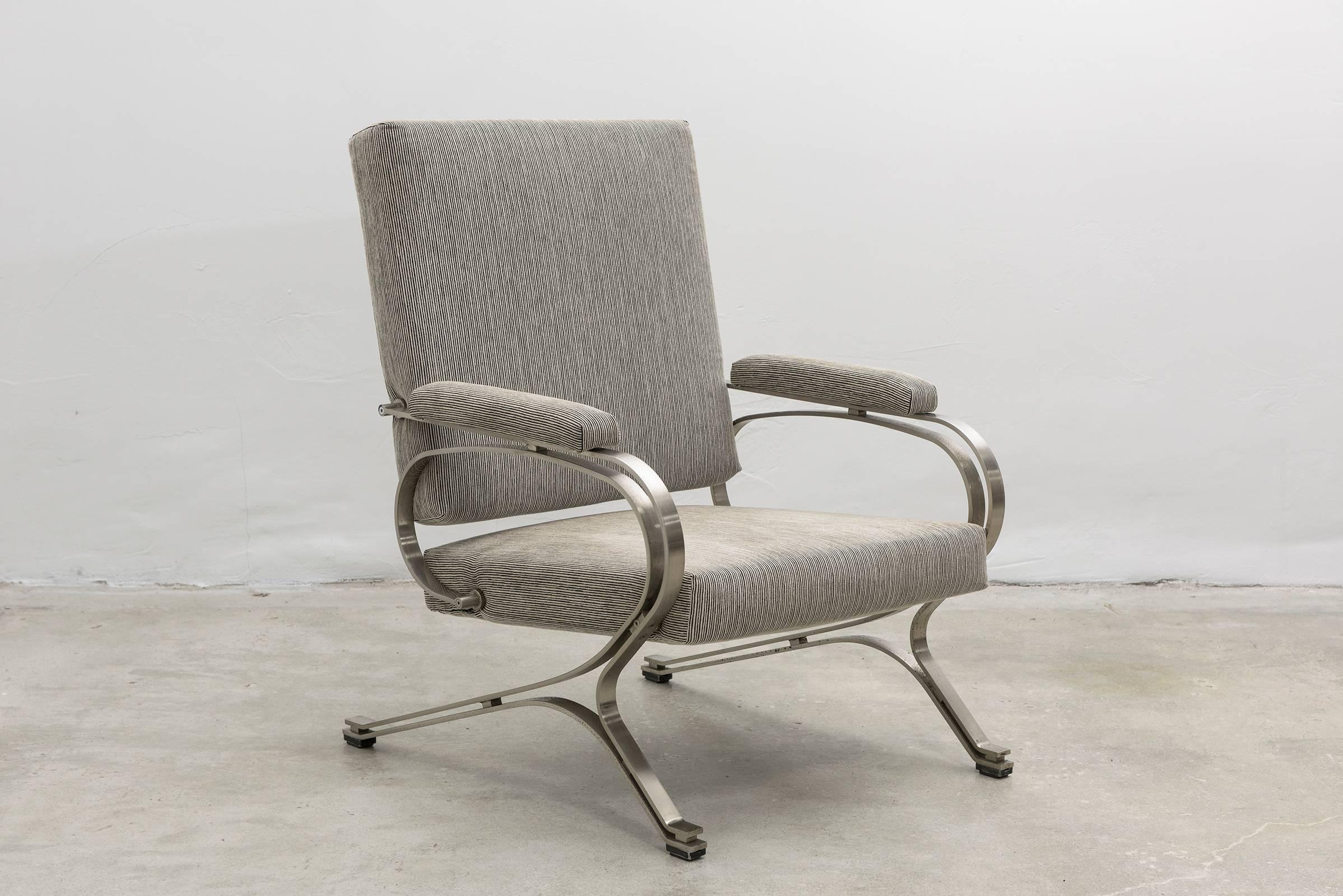 Rare vintage stainless steel armchair with matched ottoman by Giulio Moscatelli. Produced by Formanova, Milano. Expressive frame in stainless steel gives the chair some light bounce and give for comfort. Both armchair and ottoman newly