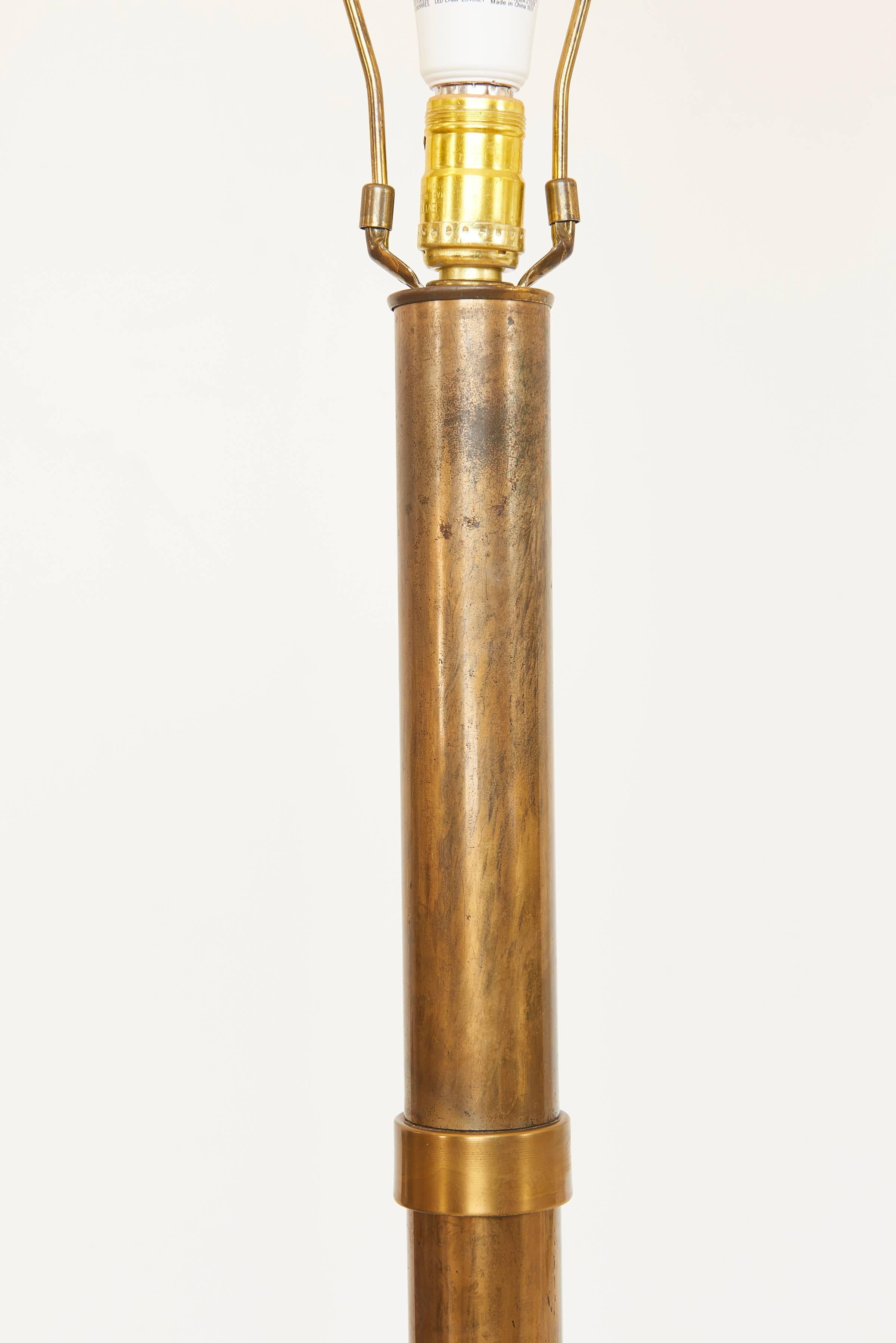 Gorgeous lacquered brass floor lamp with stylized bamboo pattern, style of Mastercraft.

Lamp measures 58 1/2 in. high to finial, 45 in. high to top of body.

Shade not included.